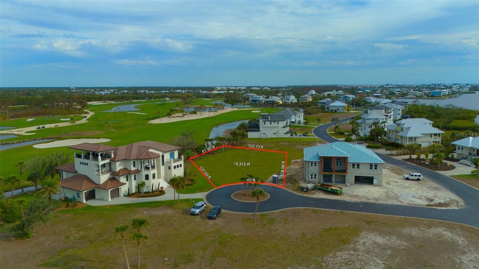 Welcome to one of the most coveted waterfront enclaves on Florida’s Gulf Coast—where timeless luxury meets coastal casual living. Situated on a serene cul-de-sac, this expansive 15,000+ square foot homesite offers sweeping views of Lemon Bay to the front and lush golf course vistas to the rear.
Set within a private, gated community adorned with multi-million dollar estates, residents enjoy underground utilities, manicured fairways, and an elegant clubhouse designed for both leisure and social connection. Whether you're teeing off at sunrise or savoring sunsets over the bay, this is a lifestyle of effortless sophistication.
With only a handful of homesites remaining, this is your rare chance to build your dream residence in a setting that’s as refined as it is relaxed. Discover luxury reimagined—where every detail evokes the essence of coastal grandeur.