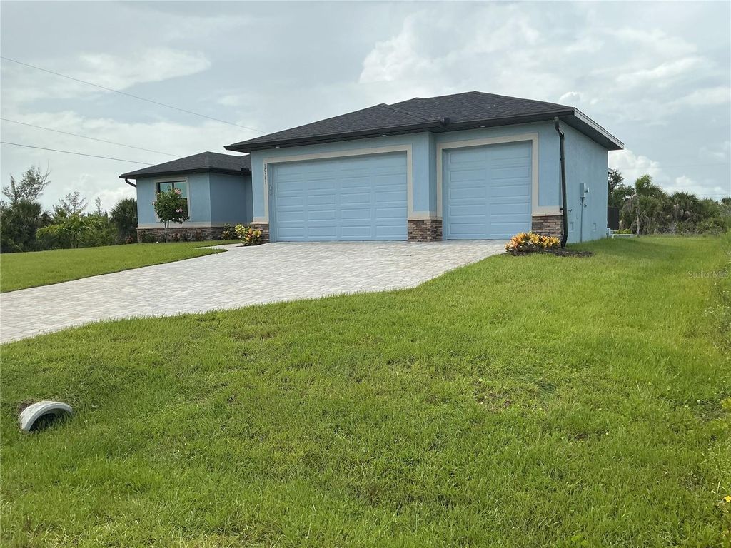 Photo of 10381 Rainsville Street, Port Charlotte, FL 33981 (MLS # O6326991)