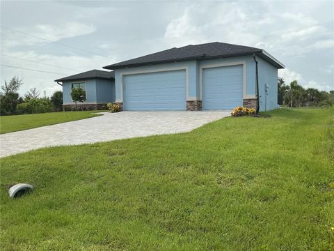 Photo of 10381 Rainsville Street, Port Charlotte, FL 33981 (MLS # O6326991)