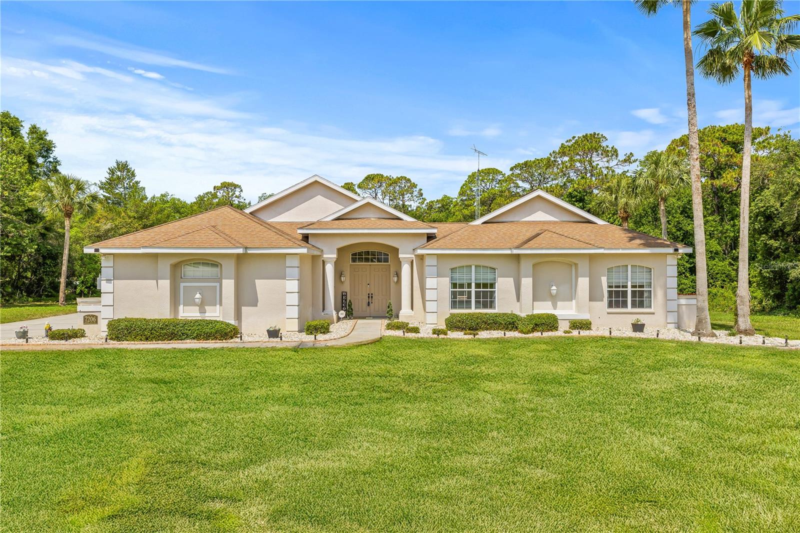 Welcome to River Country Estates, one of Weeki Wachee’s most sought-after communities, where space, privacy, and Florida lifestyle blend seamlessly. This 5-bedroom, 4-bathroom courtyard pool home is a rare find—designed in a unique U-shaped layout that wraps around a massive 1,400 sq ft screened pool courtyard. Nearly every room opens directly to the pool, creating true indoor-outdoor living that’s perfect for entertaining, relaxing, and enjoying the Florida sunshine year-round. NEW roof and AC to be installed prior to closing!!
Inside, the main residence features 3 bedrooms and 3 bathrooms, soaring 10-foot ceilings, and sun-filled living spaces. The chef’s kitchen boasts updated stainless steel appliances, ample counter space, and a layout designed for both function and style. The oversized great room flows effortlessly to the courtyard and back patio, offering multiple gathering spaces.
The primary suite is a private retreat with direct pool and patio access, dual vanities, a soaking tub, a walk-in shower, and an expansive closet.
A separate 2-bedroom, 1-bathroom guest suite with a private entrance opens to the pool courtyard—ideal for multigenerational living, an in-law suite, or an income-producing Airbnb.
Additional features include:
A spacious 3-car garage
Fully paid-off solar panels for energy efficiency and lower bills
Over an acre of landscaped grounds backing to a serene greenbelt for added privacy
All of this is less than 2.5 miles from the world-famous Weeki Wachee Springs, kayaking on the crystal-clear river, Hernando Beach, Gulf Coast fishing, and local shopping and dining. If you’ve been searching for a Florida pool home with space, versatility, and sustainable features, this is the one you’ve been waiting for.