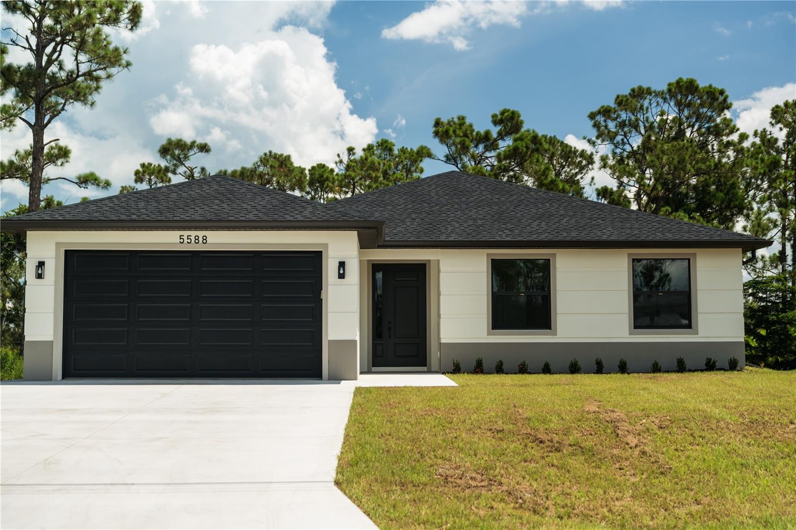 BRAND NEW CONSTRUCTION. This is not your average new build. Step inside a custom engineered home where style meets substance. HURRICANE IMPACT WINDOWS THROUGHOUT. With soaring high ceilings, an open layout, this 3-bedroom, 2-bath STUNNING home was built to impress - and built to last! Every corner reflects thoughtful design: from the MODERN KITCHEN, TREY CEILINGS, to the designer-inspired finishes, NO DETAIL WAS OVERLOOKED. It's luxurious, yet practical. Bold, yet timeless. A home that feels as good as it looks. Don't settle for basic cookie-cutter homes: come see why this isn't just another house - it's the one.
