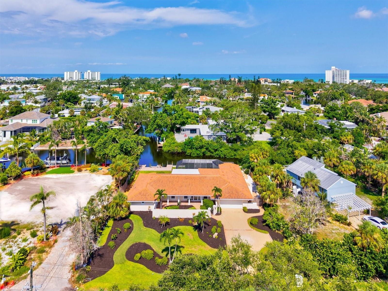 One or more photo(s) has been virtually staged. Discover this FULLY RENOVATED four-bedroom, three-bathroom sanctuary spanning 3,541 square feet, where luxury living meets WATERFRONT tranquility. Situated on almost a half acre lot, with rear views facing west for colorful sunsets, this meticulously crafted residence boasts a heated pool, a floating dock and long seawall inviting water enthusiasts to enjoy exploring the canals which lead out to the open waters of Sarasota Bay.
The heart of this distinguished home features an expansive open-concept main living area, chef's kitchen and spacious dining space, thoughtfully designed to accommodate family and guests while offering sweeping views of the sparkling pool and canal. The seamless flow of the layout and blending of the outdoor and indoor space creates an entertainer's paradise, perfect for culinary adventures and memorable gatherings.
Retreat to the luxurious primary bedroom, where panoramic canal vistas provide a serene backdrop for morning coffee or evening reflection. Unwind in the spa-like bathroom featuring a soaking tub, walk-in shower, dual vanities and frosted sliding glass doors to the outdoor shower. The SPLIT FLOORPLAN ensures ease and privacy for all. Bedroom 2 features an en-suite bathroom and long water views! Bedroom 3 has double doors and can be utilized as a den or office space if desired. Bedroom 4 has a private entrance with sliding glass doors overlooking the sunny front courtyard. This thoughtful layout offers many options for use of the generous space.
The coral stone tiled pool and lanai area transforms into your personal oasis, where gentle breezes dance across the water's surface, creating an atmosphere of pure indulgence after sun-soaked beach days. The fully fenced yard, greenspace, winding walkways, outdoor shower, 2 car garage with extended driveway and parking space complete this comfortable retreat.
The property's exceptional LOCATION places you moments (just .6mi) to the vibrant Siesta Village, where boutiques and acclaimed dining establishments await your discovery. (Just .7mi) to the nearest beach access! The main entrance to World-renowned Siesta Beach, celebrated for its powdery white sands and crystal-clear waters, beckons just over a mile away. This remarkable residence represents more than mere accommodation; it embodies a lifestyle where every detail has been carefully considered.
From the quality construction evident throughout to the thoughtful integration of indoor and outdoor living spaces, this home promises years of comfort in one of Sarasota's most coveted waterfront communities.