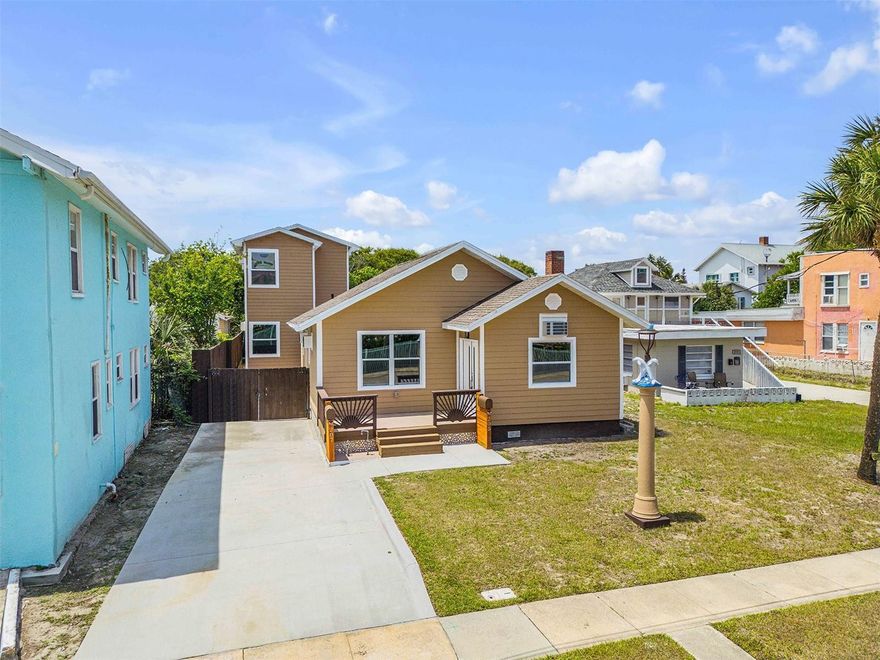 Explicitly designed for the astute investor and or an owner-occupied for positive cash flow revenue generating property, completely rebuilt and beautifully reimagined, this exceptional multi-unit property at 205 N Wild Olive Ave offers a rare turnkey investment opportunity in the very heart of everything Daytona Beach is world renown for. Located just steps from the sand and directly across from Daytona Lagoon, this property combines modern construction with unbeatable location and features upscale accommodations. This property features upscale accommodations. Unit 205 is approx 1100 sqft and is a 1 story distinctly renovated beach house featuring 2 bedrooms, 2 full sized baths, 1 spare room could be utilized as an office, bonus room or 3rd sleeping quarters, offering a potential 3rd bedroom or office space. The front residence has been taken nearly down to the studs and fully reconstructed into a stunning single-story home featuring 2 bedrooms and 2 bathrooms. Everything is brand new- from the redesigned floor plan and updated siding to the roof, appliances, and finishes--while preserving the charm of the original fireplace. Unit 207 is approx 1300 sqft and is a 2-story brand-new build from the ground up. Behind the main home, a newly constructed two-story building adds two additional units--one upstairs and one downstairs--each offering 2 bedrooms and 2 bathrooms. In total, the property includes three spacious 2/2 units, all thoughtfully designed with modern living in mind. Both buildings were designed and constructed with accentuated attention to the smallest details. All New plumbing & electric, Interior walls insulated, above code required measures for adverse weather conditions. Residents will appreciate the convenience of a separate outdoor laundry building with a large washer/dryer area, as well as proximity to everything Daytona Beach has to offer. Located within walking distance to the Ocean Center and near Peabody Auditorium, plus just minutes from the river, beaches, shopping, dining, and vibrant nightlife. Exceptional Cap rates Above 7 percent utilizing all rentable space, above 4 percent as an owner-occupied situation. In either scenario, the new owner will enjoy a safe & reliable R.O.I. Whether you're looking to expand your portfolio or secure a high-demand rental property in a prime coastal location, this fully renovated triplex is a standout opportunity.
