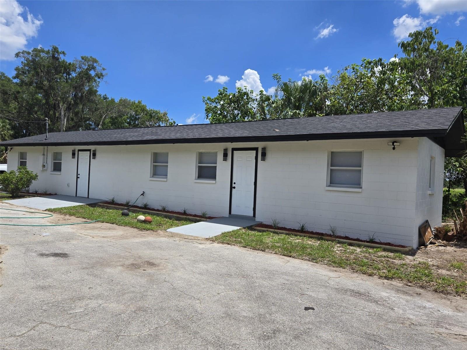 Don't miss this Unique opportunity to own this beautifully renovated 3-bedroom, 2-bathroom home on an oversized 30,000 sqft lot! This move-in ready property features an open-concept layout perfect for comfortable living and entertaining. Enjoy a stunning kitchen with brand-new cabinets, quartz countertops, a modern backsplash, and new stainless steel appliances. Additional upgrades include new water-resistant laminate flooring, updated bathrooms, a brand-new A/C system, new water heater, new architectural shingle roof, updated light fixtures, and fresh interior and exterior paint. With ample yard space, this home offers endless potential—whether for outdoor entertaining, expansion, or adding a pool. Conveniently located near schools, shopping, and major highways. A must-see!