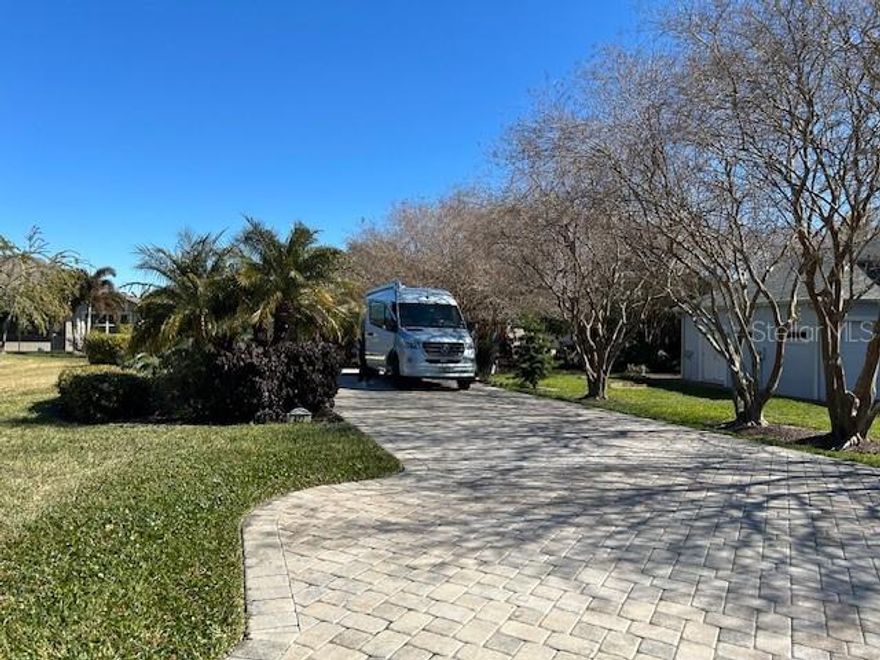 Discover the perfect blend of resort-style living and RV luxury at 427 Travelers Dr. in Polk City, FL. This buildable Class A Motorcoach Lot spans an impressive 8660 square feet, offering a beautifully maintained pad with full hookups and room to relax or entertain in style. Situated in a gated 55+ community, this lot grants exclusive access to a wealth of amenities including two clubhouses, two heated pools, six pickleball courts, and a full calendar of daily social activities designed to bring neighbors together. Whether you're looking for a seasonal getaway or a full-time residence, you'll love the sense of community and peaceful surroundings. With friendly neighbors, beautifully manicured grounds, and quick access to nearby attractions in Central Florida, this property offers the ideal retreat for discerning RV owners seeking comfort, connection, and a vibrant lifestyle.