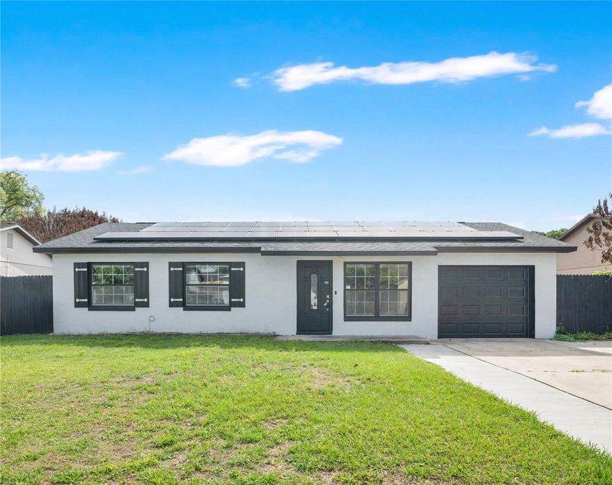 Nestled in the heart of Orlando, 3810 Beachman Drive offers the perfect blend of neighborhood charm and modern living. UPGRADES include FRESH PAINT 2025, NEW WINDOWS 2025, HOT WATER HEATER 2025, ROOF 2020, STAINLESS STEEL APPLIANCES 2021, TILE FLOORING, UPGRADED BATHROOM 2023, NEW CEILING FANS 2025, SOLAR PANELS, AC 2025, EXTERIOR FENCING 2025.
