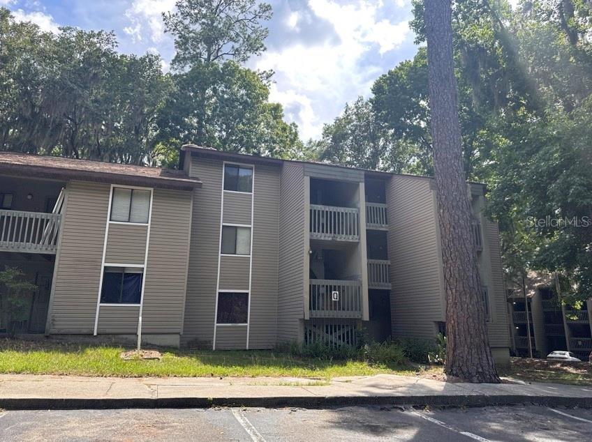 Charming Condo in Treehouse Village - Ideal for Roommates! This condo features two spacious primary bedrooms, each with its own private bathroom. Enjoy the convenience of a washer and dryer right in your condo along with modern comforts of NO CARPET and a young air conditioning system just installed last year. There's an on-site management office that accepts packages on behalf of the residents and keeps an eye out on the property. Take advantage of the on-site pool and the 24-hour fitness center. This prime location is less than 2 miles from the University of Florida, with easy access to the airport, shopping and hospitals. Experience the perfect blend of location, amenities, and convenient living in Treehouse Village. This condo stands out in Gainesville's rental market and is ready to welcome you home!