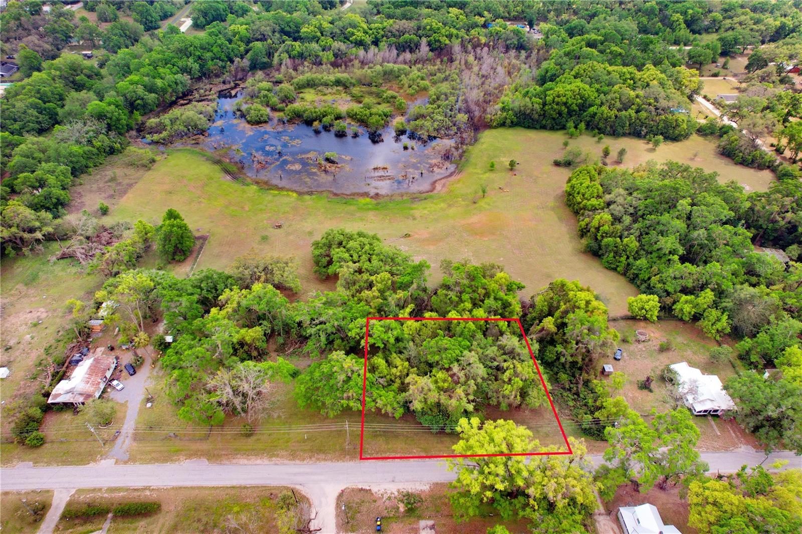 NO HOA.....NO CDD.....YES PLEASE!!! Build your dream home on this beautiful unimproved parcel on just over a half-acre in Dade City. There are no utilities on this property but electric is available at the street and county maps indicate municipal water line at Trilby Road (Buyer to Confirm). The seller has the propsed subdivision survey in hand available to make it 2 buildable lots. Potentially building on both, living in one and having rental income on the other. Endless possibilities for gardening, growing vegetables, and a citrus tree is already producing!! Only minutes to downtown Dade City full of shops and restaurants and minutes to the Withlacoochee Trail for hiking, camping & fishing. Come enjoy what nature has to offer.