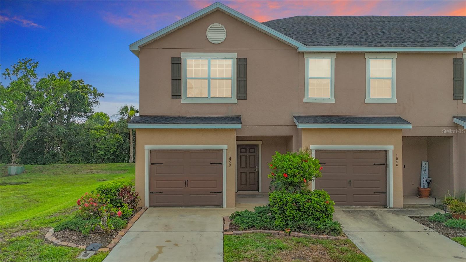 $25,000 price improvement! Welcome to this well-appointed 3-bedroom, 2.5-bathroom end-unit townhome offering 1,713 sq ft of thoughtfully designed living space in the highly desirable community of Bradford Manor. This spacious, light-filled home boasts an open-concept floor plan and tasteful upgrades throughout. Step into elegance with engineered hardwood flooring in the main living areas, upstairs hallway, and two bedrooms. The modern white kitchen features ceramic tile flooring, upgraded Samsung stainless steel appliances, granite countertops, Aristokraft solid wood cabinetry with dovetailed drawers, and soft-close features on all upper and lower cabinets. A large breakfast bar comfortably seats 5–6, making it ideal for entertaining. Enjoy the convenience of a powder room on the main level, while upstairs you’ll find two full bathrooms. The primary suite is a true retreat, offering two closets and an en-suite bath with dual sinks and a walk-in shower with upgraded full-wall tile. Two additional bedrooms share a beautifully appointed full bathroom with dual sinks and a tub/shower combo, also enhanced with full-wall tile. Step outside to your private, covered lanai overlooking a serene natural preserve—perfect for morning coffee or evening relaxation. For added safety and energy efficiency, impact windows have been installed on the left side lower and upper level of the home. Additional highlights include a one-car garage with built-in metal shelving, ample storage throughout, and a bright, open upstairs hallway. Residents of Bradford Manor enjoy access to a heated community pool and the convenience of a private rear entrance/exit reserved for homeowners. Located just minutes from Neiborhood schools, shopping, dining, beautiful beaches, and major highways, this home offers the perfect blend of comfort, style, and location. HOA IS ONLY $299 A MONTH which includes PREMIUM CABLE AND INTERNET. Don’t miss your opportunity—schedule a showing today!