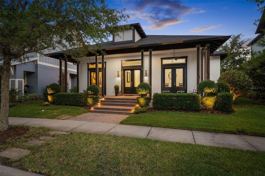 Located in the highly sought-after Laureate Park community in Lake Nona, this stunning one-story Ashton Woods Estate Series (Lahey model) home offers 3,127 square feet of masterfully crafted living space. Step through elegant glass double front doors into a soaring foyer crowned by a dramatic circular tray ceiling and striking contemporary light fixture. Inside, 13-foot ceilings, flat-finish drywall, custom light fixtures, and large baseboards create an atmosphere of refined elegance. Banks of large windows topped with transoms flood the open living area with natural light. The chef's kitchen features rich cabinetry, granite countertops, a large center island with seating for four, and stainless appliances including an induction cooktop, double built-in convection oven, and refrigerator. A butler's pantry with wine chiller completes this exceptional culinary space. The primary suite offers a tray ceiling, French doors to the outdoors, dual vanities, a glass-enclosed walk-in shower, and a garden soaking tub. Two additional bedrooms include walk-in California Closets. A private detached casita with full bath is perfect for guests or extended family. Outdoors, a covered lanai overlooks a paver entertaining area with a fully equipped summer kitchen. Unwind in the above-ground Jacuzzi hot tub in a private fenced area with tropical landscaping. French drains and a detached 3-car garage round out the exceptional outdoor space. New solar panels with a 16-year warranty and a Tesla Powerwall allow the home to operate completely off the grid owners report no electric bill(only a service fee) since installation. Additional highlights include a brand new roof, new Puron Series AC, whole-home reverse osmosis filtration, and a dedicated home office. Laureate Park amenities include an aquatic center, trails, parks, and Lake Nona Town Center just minutes away. This is a rare find call today!