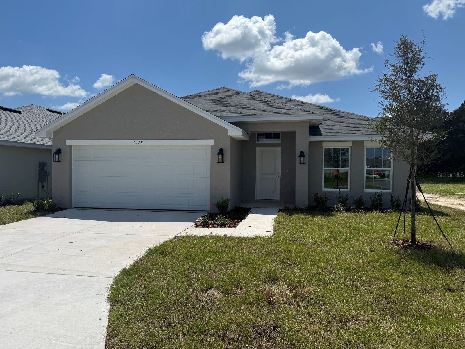 Under Construction. Brand new 2020 sq ft, 4 bed / 2 bath home in a community with nature park/trails nearby, easy access to I-75 and close to Ocala historic district, shopping, and dining. Estimated completion is September. This home features tile in the wet/entertainment areas and carpet in the bedrooms. Home also has granite countertops and shaker cabinets in the kitchen and bathrooms. Kitchen has a stainless steel range, microwave and dishwasher. Owner's bathroom has a large 5 foot wide tiled shower. Home also has TAEXX in-wall pest control system and a Builder Warranty. Community Center opening soon with pool, fitness center, community room and playground!! THIS HOME QUALIFIES FOR A LOW INTEREST RATE BUYDOWN, ALL APPLIANCES, AND BLINDS WHEN BUYER CLOSES WITH A SELLER APPROVED LENDER AND SIGNS A CONTRACT BY SEPTEMBER 7, 2025. INTERIOR PICTURES ARE FROM A SIMILAR HOME WITH SAME FLOOR PLAN. OPTIONS AND COLORS MAY VARY.