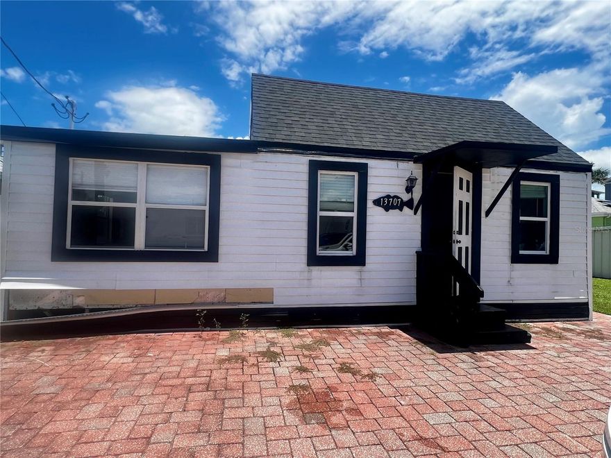 ***PRICE IMPROVEMENT!!! Coastal Charm in a Compact Package! Your Madeira Beach Bungalow just a block from the Gulf of American and public beach access.
Discover the delightful efficiency of this "Cute as a Button" bungalow at 13707 Plymouth St, Madeira Beach, FL! Though a cozy 646 sq ft, this charming 3-bedroom, 2-bath home including a loft is packed with potential and an unbeatable location, just a 3-minute stroll north of the vibrant John's Pass Village.

Step inside and envision your perfect coastal getaway. Ingeniously designed, this bungalow makes the most of every square foot. While county records historically show a 2-bedroom, 1-bath configuration, the home was thoughtfully converted with high ceilings, a loft, and an additional bedroom and bathroom, maximizing the living space. Amazingly, two of the bedrooms were spacious enough to accommodate a king-size bed and dresser, offering surprising comfort in this compact footprint. Recent updates include a new roof in 2022 and remodeling completed in 2022, ensuring a solid foundation for your vision.

One of the most captivating features is the direct Gulf access located just across Gulf Boulevard, visible right from your front door! Imagine the convenience of beach days and stunning sunsets just steps away. The property also features a paver driveway that extends to the back of the home, providing convenient parking and access.

This home previously commanded a lease rate of $3,000/monthly, highlighting its impressive income potential despite its size. Following Hurricane Helen, the substantial damage determination has been reversed, opening the door for a new owner to remodel and personalize this home to their exact specifications. This is your chance to create the Madeira Beach oasis you've always dreamed of, a perfect blend of charm and efficiency!

Don't miss out on this unique opportunity to own a piece of paradise with incredible potential in a highly sought-after location.
***This home will qualify for a rehab loan.