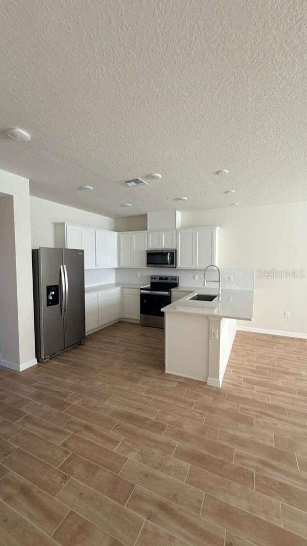 Photo of 4564 Maple Waltz Alley, Clermont, FL 34714 (MLS # O6372163)