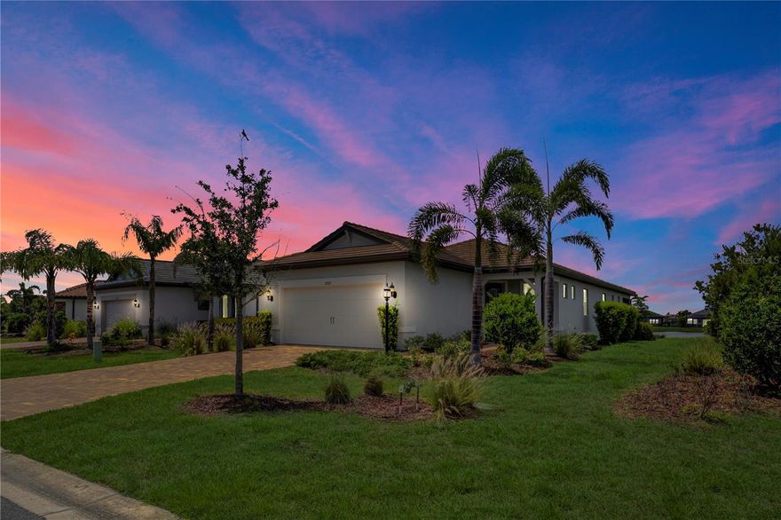 NEW PRICE IMPROVEMENT !!Step into sunlit sophistication with this gorgeous 4-year-old Contour model in the completely sold-out, resort-style 55+ community of Del Webb Lakewood Ranch—where luxury meets lifestyle and every detail sings. Set against peaceful water views and lush, manicured landscaping, this 1,400 sq ft home is both a serene retreat and an entertainer’s dream, welcoming you with a glass-paneled front door and flowing open-concept design. The chef-inspired kitchen is the heart of the home, complete with a large granite island, upgraded vented hood, wall oven and microwave, walk-in pantry, pull-out cabinet drawers, and sleek KitchenAid stainless appliances—framed by designer pendant lights that echo through the stylish dining space. Natural light pours into the great room, connecting seamlessly to the extended screened lanai, creating the perfect indoor-outdoor flow for sunset dinners and lively gatherings. The primary suite is a private sanctuary with dual sinks, a frameless glass shower with bench and grab bar, walk-in closet, linen storage, and its own water closet, while the tucked-away guest bedroom and second full bath features comfort and privacy for visitors. A French-doored flex room gives you space to create, work, or unwind, while timeless finishes like plantation shutters and oil-rubbed bronze fixtures add warmth and elegance throughout. A dedicated laundry room, 2-car garage with upgraded flooring, and smart layout make everyday life effortlessly beautiful. Just steps away from all that Del Webb offers—clubhouse, indoor and outdoor pools, 8 pickleball courts, tennis, bocce, fitness center, restaurant, and endless activities—plus unbeatable access to Lakewood Ranch’s shopping, dining, golf, beaches, medical care, and more. This isn’t just a home—it’s your next great chapter, wrapped in sunshine and ready to live large.