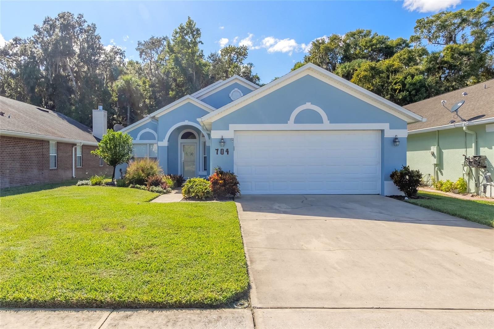 This house comes with a REDUCED RATE as low as 6.000% (APR 6.243%) as of 7/29/2025 through List & Lockâ„¢. This is a seller paid rate-buydown that reduces the buyer's interest rate and monthly payment. Terms apply, see disclosures for more information. t
Welcome to the peaceful Florida lifestyle at 704 Coral Trace Blvd in Edgewater, FL. Nestled in the desirable gated community of Coral Trace with underground utilities and easy access to I-95, this home perfectly balances comfort, convenience, and tranquility.
Featuring 3 bedrooms, 2 bathrooms, and a 2-car garage, this solid concrete block home offers lasting durability. A brand-new roof provides peace of mind for years to come, while a thoughtful split floor plan ensures privacy for all. The remodeled kitchen shines with modern appliances, stylish cabinetry, and ample counter space—ideal for everyday living and entertaining. Vaulted ceilings in the main living area create a bright, open atmosphere, and a screened-in lanai invites you to relax and enjoy the Florida sunshine. Step outside to your private backyard, backing up to a wooded preserve for a serene natural view.
As part of this vibrant community, you’ll enjoy amenities such as a sparkling pool, fitness center, clubhouse, and HOA-maintained lawns. Even better, the seller is offering a permanent rate buydown, making this home not only beautiful but also more affordable.
Don’t miss this opportunity to make 704 Coral Trace Blvd your new home. Schedule your showing today and start living the Florida dream.