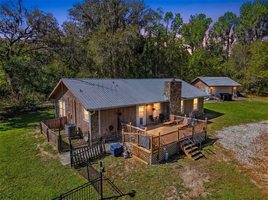 Peaceful country living on 10+ acres featuring a 3BR/2BA home with a large detached 2-car garage. This home offers a split-bedroom floor plan, open living and dining space, indoor laundry room, and a cozy fireplace.

The kitchen flows seamlessly into the living and dining areas, creating an ideal layout for everyday living and entertaining. Updated kitchen and bathrooms along with major improvements including roof, HVAC, and ductwork replaced in 2020, plus new well pump in 2025.

Enjoy Florida’s natural surroundings from the screened porch with waterproof decking added in 2021. Plenty of room for privacy, outdoor activities, hobbies, animals, or additional storage.

This is 2 parcels adjacent to each other. Sold together as the 10+ acre parcel with home. A rare opportunity to enjoy privacy and space while still being within reach of everyday conveniences.