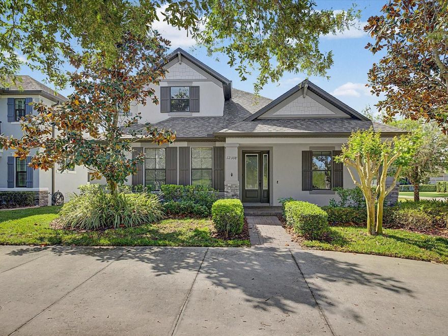 One or more photo(s) has been virtually staged. Located in the highly sought-after master-planned community of Starkey Ranch, this upgraded “Hamilton Bonus” floor plan by M/I Homes offers 3 bedrooms, 3 full bathrooms, and 2,620 square feet of thoughtfully designed living space. This home features fresh interior and exterior paint and includes recent updates such as a newer washer and dryer, tankless hot water heater, and pool pump. The open-concept layout is enhanced by engineered hardwood flooring throughout the main living areas, creating a warm and cohesive feel. The formal dining room is positioned at the front of the home with high ceilings and convenient access to the kitchen. Two secondary bedrooms and a full bathroom with dual sinks and granite countertops are located on the main level. The kitchen is designed for both function and style, featuring upgraded cabinetry with crown molding, quartz countertops, a large center island with seating, stainless steel appliances, and a gas cooktop. The adjoining living room offers a tray ceiling and overlooks the outdoor living space. The primary suite is privately situated and includes a tray ceiling, a custom built-in walk-in closet, and an en-suite bathroom with dual granite vanities, a walk-in shower with floor-to-ceiling tile, and glass enclosure. Upstairs, a spacious bonus room/loft provides additional flexible living space along with a full bathroom, ideal for guests or entertaining. The laundry room is equipped with floor-to-ceiling cabinetry, a utility sink, and a gas dryer. The garage includes overhead storage racks for added convenience. Outdoor features include a covered and screened lanai with a saltwater, gas-heated pool and spa, lighting, and a safety fence, along with mature landscaping for privacy. Additional features include a water softener and reverse osmosis system. Conveniently located near Starkey Ranch K-8 School, parks, trails, and community amenities.