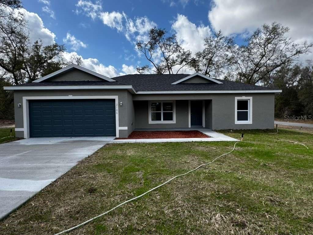 Photo of 2186 W G Martinelli Blvd, Citrus Springs, FL 34434 (MLS # O6384317)