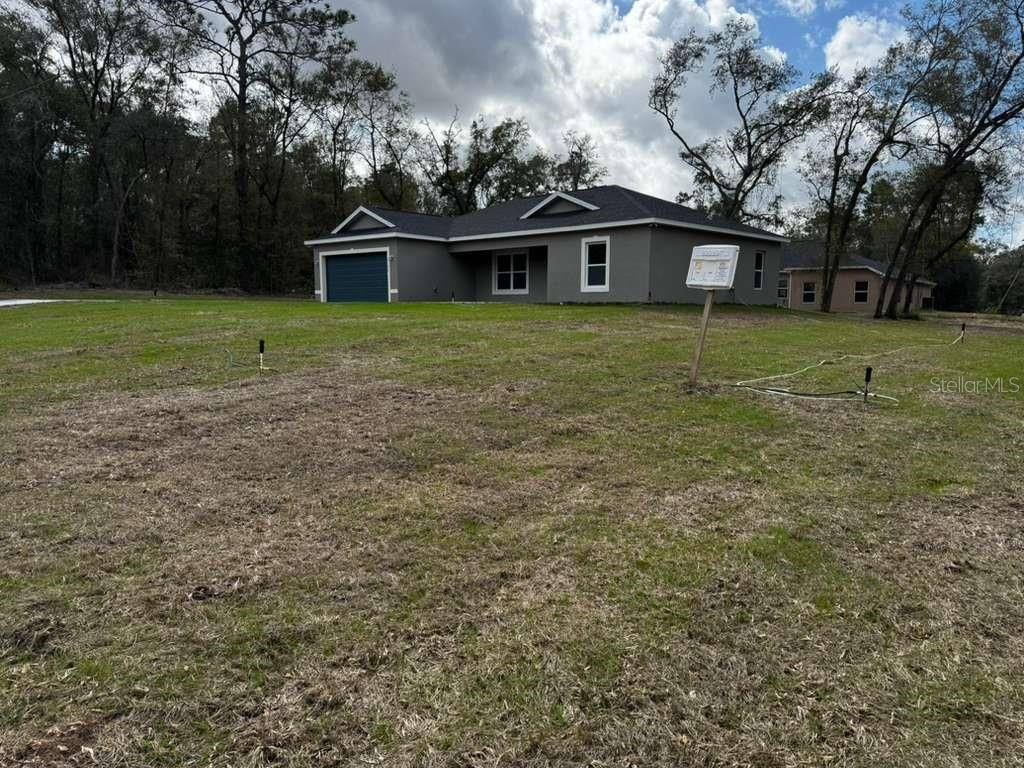 Photo of 2186 W G Martinelli Blvd, Citrus Springs, FL 34434 (MLS # O6384317)