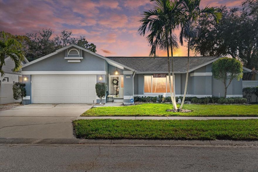 Welcome to 9320 126th Avenue N, a fully renovated and meticulously maintained three bedroom two bath pool home located in unincorporated Largo, offering flexibility and freedom from city restrictions. With over 1500 square feet of living space, this thoughtfully designed split floor plan includes a formal living room and dining room, as well as a spacious family room featuring cathedral ceilings and a marble wood burning fireplace, creating a warm and inviting atmosphere for both everyday living and entertaining. The updated eat in kitchen offers solid surface countertops, stainless steel appliances, ample cabinetry, and an abundance of natural light. Travertine and engineered hardwood flooring run throughout the home, providing both style and easy maintenance ideal for Florida living. Step outside to enjoy generous outdoor living space with a sparkling pool and a newly installed screened cage, perfect for relaxing or hosting guests year round. This home offers peace of mind with hurricane impact doors and windows, additional shutters for added protection, a roof replaced in 2025, a new fence installed in 2024, LeafGuard gutters, and a pool cleaner included. Ideally located close to beaches, shopping, dining, and major roadways, this move in ready home combines modern updates, outdoor enjoyment, and a desirable non incorporated location, making it an exceptional opportunity for Florida living.