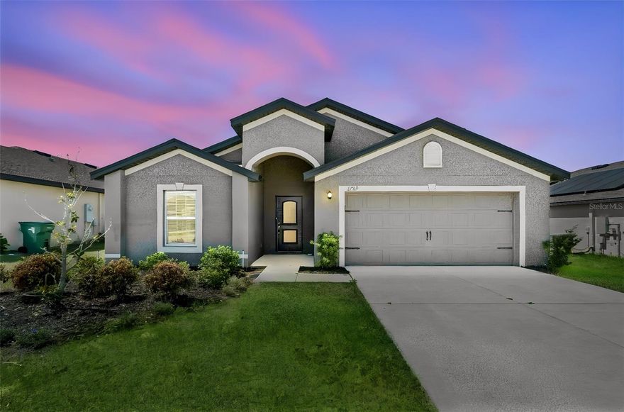 Is there a 3-bed single family home in Dundee under $300K with updated major systems and modern finishes? 1729 Canaan Loop offers 1,869 square feet, granite countertops, stainless steel appliances, and added peace of mind with a roof, HVAC, and water heater all approximately 6 years old.
Welcome to this well-maintained 3-bedroom, 2-bathroom single family home located in the Ridge at Swan Lake community in Dundee, Florida. Built in 2020, this home offers 1,869 square feet of thoughtfully designed living space on a 9,087 square foot lot, combining comfort, efficiency, and everyday functionality. Inside, you will find an open layout filled with natural light, enhanced by tile flooring in the main living areas, granite countertops, and a full suite of stainless steel appliances that bring a modern touch to the kitchen. The layout supports both daily living and entertaining with ease, while the spacious bedrooms provide flexibility for families, guests, or a home office setup.
A standout feature is the added value and peace of mind with the roof, HVAC system, and water heater all approximately 6 years old, helping reduce near-term maintenance concerns for future owners.
The exterior offers a 2-car garage and extended driveway, providing ample parking and storage. With a quarterly HOA of $350 and annual property taxes of approximately $5,109, this home presents a balanced ownership opportunity for both primary residents and investors.
Located in Dundee, this property is positioned near a wide range of Central Florida attractions and conveniences. Enjoy close proximity to Bok Tower Gardens, LEGOLAND Florida Resort, Eagle Ridge Mall, and Lake Eva Community Park. Outdoor enthusiasts will appreciate nearby access to Circle B Bar Reserve, Colt Creek State Park, and Lake Hamilton for recreation and relaxation.
Families benefit from nearby schools including Dundee Ridge Middle Academy, Dundee Elementary Academy, and Sandhill Elementary School. With convenient access to shopping, dining, and major routes, this 3-bed single family home in Dundee under $300K stands out as a practical, updated, and well-located opportunity in today’s market.