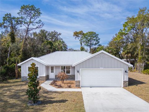 Photo of 210 Paradise Drive, Deland, FL 32720 (MLS # O6401558)