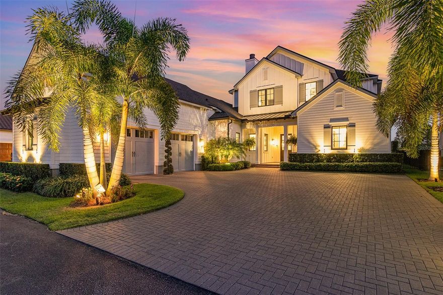 Welcome to luxury, lakeview living in Baldwin Park, where this hidden GEM awaits! Built in 2020, this waterfront masterpiece offers breathtaking lake views, unparalleled craftsmanship, and a fabulous, functional floorplan. The $125K+ in recent updates further elevate this home, including custom exterior lighting, an electric car charging port, additional landscape and hardscape, a 2nd laundry upstairs, AC unit in the garage, surround sound, whole-house water purification system, custom window treatments, and more!
Embrace the serenity, overlooking Lake Susannah and the adjacent mews/park, from the home’s outdoor oasis. Designed for optimal entertainment or relaxation, the 2 living/dining areas are wrapped in motorized phantom screens, with a gas fireplace, a complete summer kitchen, and a saltwater pool with a sun shelf, fountain, and LED lighting. The outdoor area and expansive travertine paver deck is fully fenced-in, and a block wall across the back, with integrated lighting, adds privacy. 
Step through the inviting front porch to the sunny, open living space with a gas fireplace and custom built-ins. The rear wall is adorned with sliding glass doors, framing views of the outdoor living space, pool, and the serene lake beyond, while a private front-facing office/flex room, with barn doors, provides an ideal workspace.
The expansive kitchen, with the massive quartz island, offers Monogram appliances including a 6-burner gas stove with a griddle, 2 ovens, a full-size refrigerator and freezer (both 36” wide), and a wine refrigerator. Tucked behind the kitchen is a functional scullery/butler’s pantry that is uniquely stocked with a 2nd prep sink, 2nd dishwasher, and a walk-in pantry. 
The 1st floor Primary Suite is a dream, featuring pool and lake views, a luxurious custom closet with an island, and a hidden safe room with endless uses.  A 2nd DOWNSTAIRS en-suite, with a private bathroom, offers convenient space for your guests. 
The main staircase leads to the 2nd floor, with 2 bedrooms, both with en-suite baths, a powder bath off the bonus room, and a 2nd laundry with a washer & dryer. The bonus room with vaulted ceilings is bursting with natural light, and offers custom built-ins with a wet bar and mini- refrigerator, plus a wall of expansive windows for capturing stunning sunrises and sunsets over the lake. 
The 2nd staircase, over the garage, leads up to a private, additional 5th bedroom/game room, complete with an en-suite bathroom and walk-in closet.
The impressive, oversized 2-car garage is equipped with storage cabinets by Garage Tek, indoor/outdoor carpet, and an electric car charging port, while a new mini split AC keeps it cool and comfortable. 
This home is ideally located only 3 blocks from downtown Baldwin Park’s shopping and dining, and only a few miles from the East End market, Winter Park’s Park Ave., and downtown Orlando.  With A-rated schools, this home truly has it all—a perfect blend of luxury, functionality, and serene living!