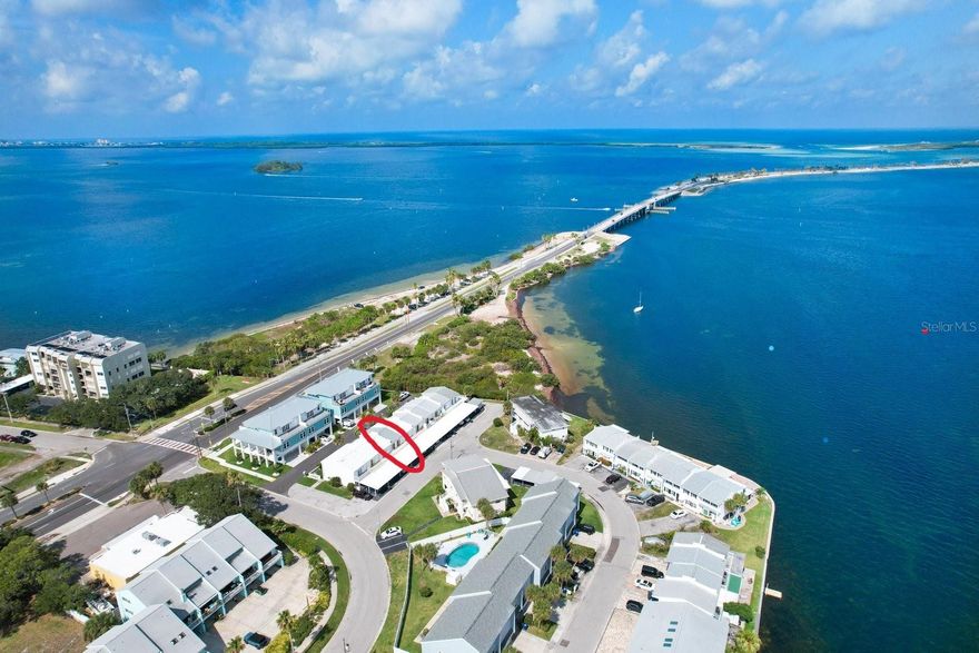 SEASONAL 6-MONTH +1 DAY MINIMUM LEASE--AVAILABLE 5/1/2026 to 12/15/2026 ONLY. LOCATION, LOCATION! This is the MOST DESIRABLE AREA at the foot of DUNEDIN CAUSEWAY & PINELLAS TRAIL overlooking HONEYMOON & CALADESI Island Beaches. RARE 3-BEDROOM, fully FURNISHED/TURNKEY 2-story townhome in cozy, all-block 10-plex with UPDATED kitchen & baths, fenced front patio, single covered carport with laundry & BBQ grill onsite. GULF VIEW from 2nd floor balcony for relaxing amongst the wildlife with a different, gorgeous SUNSET every night! Grocery, pharmacy, restaurants, shopping, banks, gas station, bus & Jolley Trolley all nearby. Enjoy eclectic DOWNTOWN DUNEDIN with its arts & craftS fests, Farmers' market, parades, music & much more. Two approved dogs up to 150#, sorry no cats. HURRY TO SEE THIS ONE!