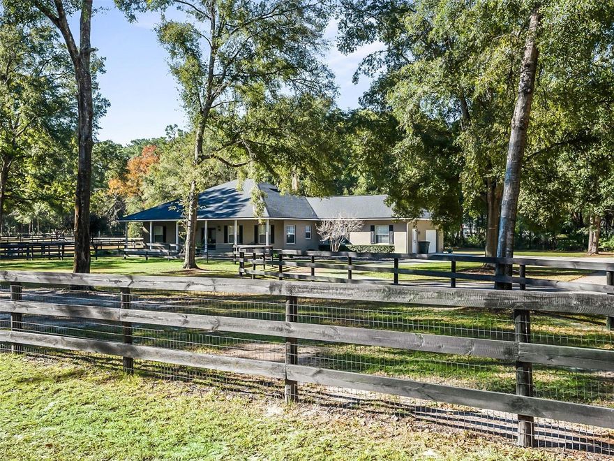 Golf cart to the World Equestrian Center located just short minutes away from this custom built concrete block home with barn & arena on over 3 acres! This turn-key mini horse farm is move-in ready for you & your horses & is fully fenced with an electric gated entrance. The pristine condition home has 4 bedrooms, 2 full bathrooms, attached garage, adorable & expansive covered front porch & covered rear patio. The house has been recently updated inside with new flooring, interior re-paint, light fixtures & more, & the gourmet kitchen boasts stainless appliances, granite counter tops, & a large island. The barn boasts 5, 12 x 12 stalls w/ mats, fans & automatic water to each, a tack/feed room w/ AC, washer & dryer, 1 wash stall, & 1 grooming stall. The riding arena is 100’ x 200’ & has a professionally installed surface with GGT fiber footing. The property provides 3 grass paddocks with 3 board wood fencing & a recently built metal storage shed. This quiet neighborhood is centrally located to shopping & schools & has no HOA. The property has a lovely circular driveway & plenty of room for parking trailers, rv’s & boats. The house can be purchased completely furnished.