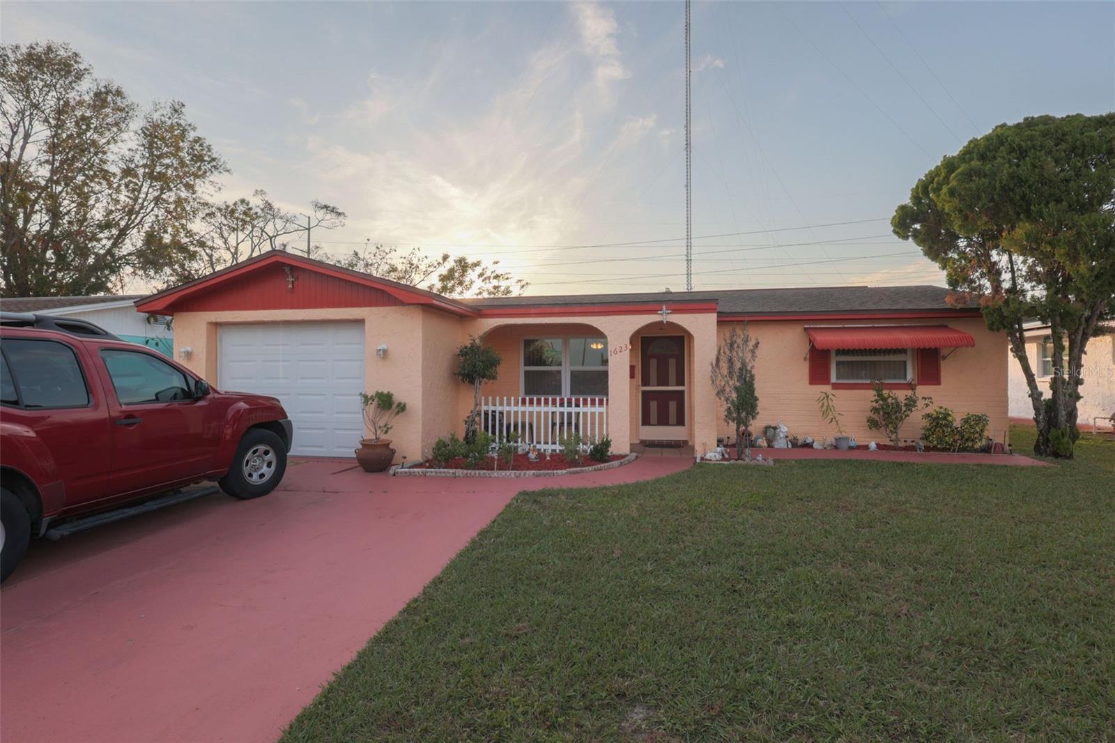 This charming 2-bedroom, 1.5-bath home (Furnished or Unfurnished) offers even more than meets the eye, with 2 additional rooms, a spacious screened-in Florida room, a backyard, and a garage, The backyard is a private oasis, featuring lush fruit trees (orange, lemon, olive, and fig), a custom brick oven, a sink, and Bluetooth speakers—ideal for outdoor entertaining.