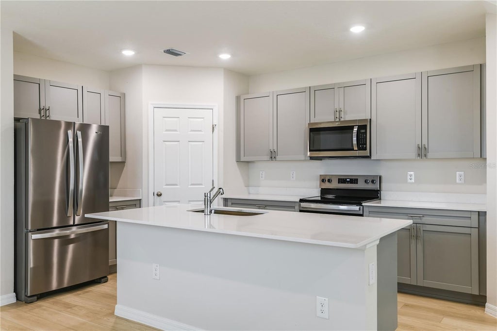Photo of 9867 Pelican Coast Drive, Dade City, FL 33525 (MLS # TB8543507)