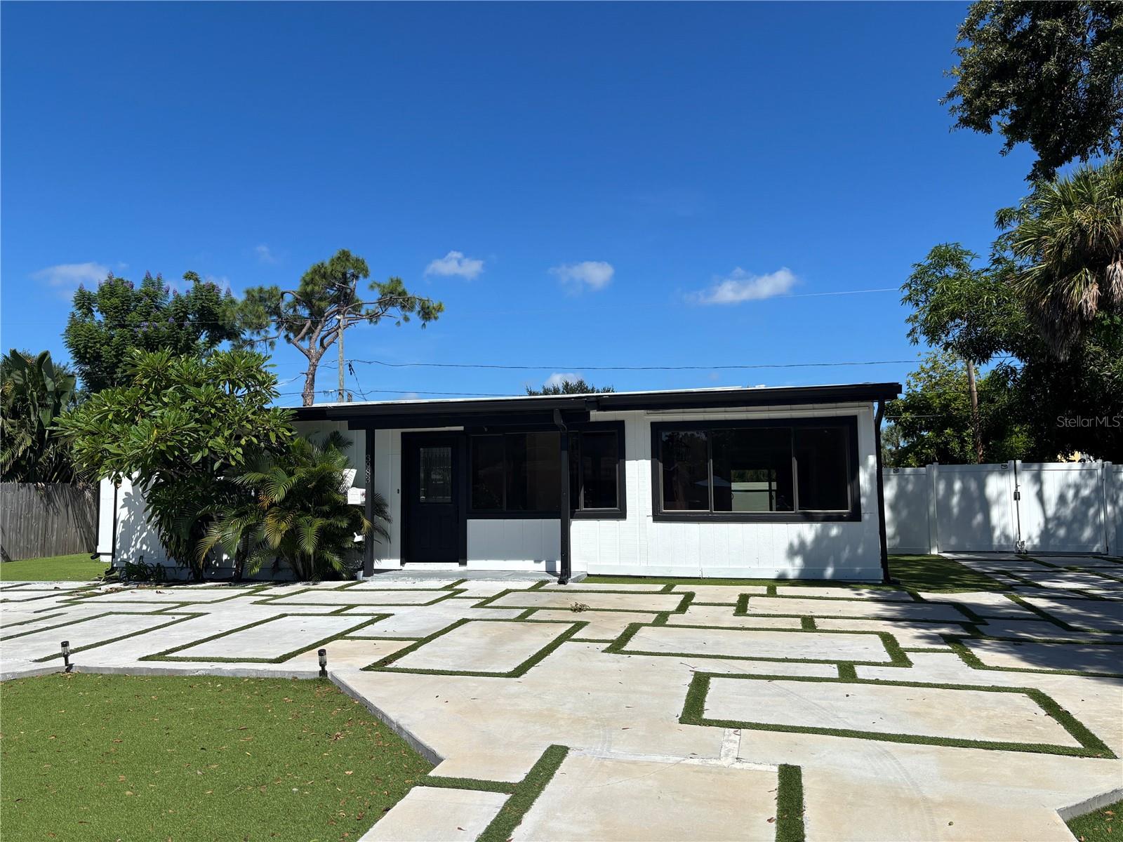 Discover coastal luxury in this stunning 3-bedroom, 2-bathroom Coquina Key rental, perfectly situated just minutes from Downtown St. Pete, Gulfport, St. Pete Pier, Tropicana Field, and vibrant eateries and museums. This modern home boasts vinyl plank flooring, a fully equipped kitchen with stainless steel appliances and stone counters, and a spacious primary suite with walk-in closets. Enjoy low-maintenance Astro turf lawns in the front and back, a fully fenced large backyard ideal for entertaining or pets (2 max) and a large circular driveway with an additional parking pad for your boat, trailer, or RV. With washer/dryer hookups, extra storage, and a relaxing enclosed lanai, this home offers convenience and style. No HOA restrictions mean you can make it your own. Just 20 minutes from St. Pete Beach and Fort De Soto, this pet-friendly gem is your ticket to the ultimate Florida lifestyle!"