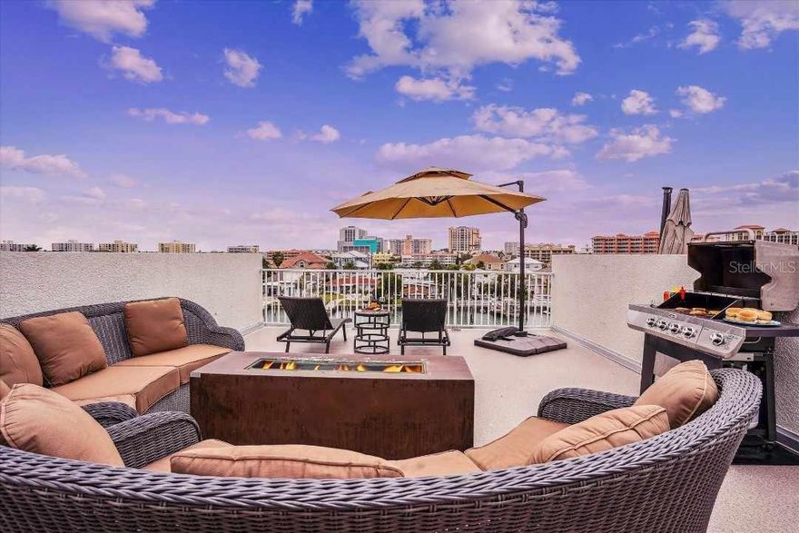 Don’t miss out on one of the finest income-producing properties on Clearwater Beach! This updated 3-bedroom, 3-bath, 4-level luxury townhome in the exclusive Paradise Cove community offers a rare combination of elegance, convenience, and premium waterfront living. Fully furnished and move-in ready, the home includes a PRIVATE BOAT SLIP with a LIFT, an expansive 1,000+ sq. ft. ROOFTOP TERRACE with stunning views of Clearwater Beach sunsets, the Intracoastal Waterway, and the nightlights of the Bay Area. The PRIVATE ELEVATOR services all four levels, including the rooftop terrace, making it a seamless experience to navigate the home.
Designed with 10-foot ceilings and HURRICANE-RATED WINDOWS and DOORS, this residence exudes coastal sophistication while ensuring safety and durability. The spacious master suite, located on the third level, features wall-to-wall windows with sweeping water views, an ensuite with dual vanities, and a private wet room featuring a stunning tub. A beautifully decorated guest suite with a full private bath and an updated laundry room with ample storage complete this level.
The second level boasts a light-filled great room with an open living and dining area, private balcony, and upgraded kitchen with granite countertops and modern appliances, updated in 2020. Another guest suite on this level offers a Juliet balcony, walk-in closet, and private access to a full bath, which was updated in 2021. The ground floor features an oversized 2-car garage and plenty of storage space for beach gear and recreational equipment.
The crowning feature of this home is the private rooftop terrace, lushly covered in premium artificial turf and fully furnished, offering an exceptional space for entertaining or relaxation. The community itself is a boutique waterfront gem, with only nine units, ensuring a serene environment and ample parking as it is the only one on the street with private driveways large enough to support 2 additional vehicles. Enjoy the south-facing pool with full sun exposure all day and fish from the private docks.
With flexible 7-day rentals allowed, no size restrictions on pets, and a low $833 monthly HOA fee, this property is an ideal choice for both investors and those seeking their own seaside retreat. Located just a 5-minute walk from Clearwater Beach, you’ll find soft white sands, clear gulf waters, vibrant restaurants, bars, and shopping right at your doorstep. Recent updates include NEW AC UNITS installed in 2019 and 2020 and a NEW ROOF 2024, and all the units have recently had their EXTERIORS PAINTED 2024. 
Whether you’re looking for an upscale vacation home or a lucrative investment property, this townhome offers the best of Florida living in one of the most sought-after locations. Schedule your private tour today!