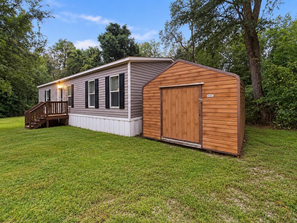 Photo of 20425 29th Drive, Wellborn, FL 32094 (MLS # O6451790)