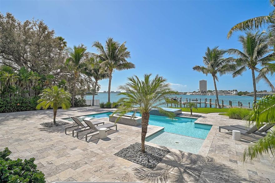 Breathtaking Bayfront Estate on Bird Key | 5 Bedrooms | 5.5 Bathrooms | 5,176 SF | .69 Acre |

Experience the pinnacle of Sarasota Bayfront living in this breathtaking Bird Key estate, where timeless coastal elegance meets modern luxury. Perfectly positioned to capture sweeping bay views and unforgettable sunsets, this 5,176-square-foot residence and largest lot in Bird Key offers refined elegance, modern comfort and sophistication inside and out.

A grand paver driveway welcomes you to the beautiful oversized glass doors through which you enter into an awe-inspiring open layout showcasing abundant brightness and natural light throughout, soaring tray ceilings complete with beautiful crown molding, designer finishes, and spectacular glass walls framing the exquisite outdoor space and sparkling waters beyond. The gourmet chef’s kitchen is a true showpiece featuring top-of-the-line appliances, custom cabinetry, and a spacious island ideal for entertaining. The home also includes a dedicated office, elegant formal and casual living spaces, 5 spacious bedrooms, 4 that offer their own private ensuite, and a well-appointed stylish game room for relaxed gatherings. 

Step outside through the expansive glass sliders to a stunning resort-style pool complete with sun shelves, a spa and a luxurious travertine sun deck overlooking tranquil Sarasota Bay complemented by a full outdoor kitchen as well as covered lounge and dining areas designed for year-round enjoyment.

Enjoy direct access to the water from your private beach, dock and boat lift, or stroll to nearby St. Armands Circle and downtown Sarasota. With its rare combination of privacy, luxury, and prime bayfront location, every detail of this Bird Key oasis has been thoughtfully crafted to offer the ultimate and unparalleled coastal lifestyle-where luxury, comfort and natural beauty converge.