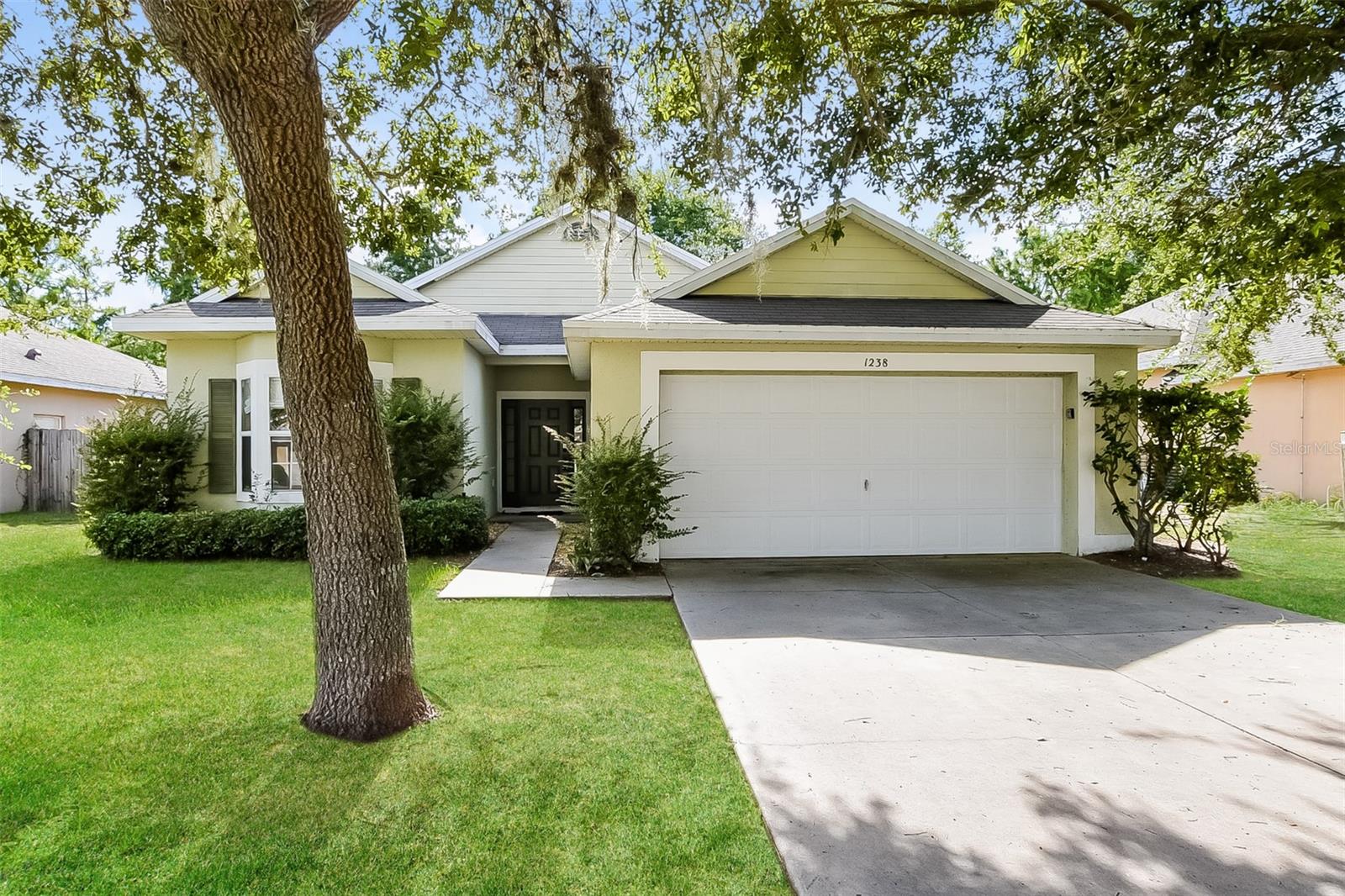 Charm and curb appeal abound for this Tavares home! Step inside into the inviting foyer and through into the dining room, which leads to the well-appointed living room. The kitchen features stainless steel appliances, hard surface countertops, and ample storage. This split floorplan offers the primary suite and laundry room on one side of the home and two secondary bedrooms on the other. Come and see for yourself the possibilities that this home has to offer!
