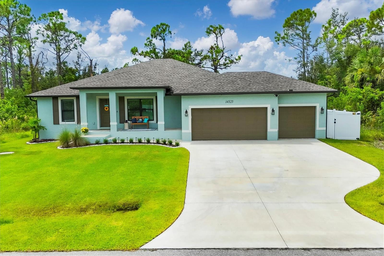 Nearly new coastal-style home with 3 bedrooms PLUS an office/den/flex room, 2 baths, and an oversized 3-car garage with a saltwater pool and spa in desirable South Gulf Cove! This open-concept retreat highlights crown molding, tray ceilings, shiplap accents, porcelain plank tile, and level 4 granite throughout. The chef’s kitchen boasts solid wood soft-close cabinetry, Whirlpool stainless steel appliances, TWO pantries, tiled backsplash, and a large center island. The private owner’s suite offers direct patio access, a large walk-in closet and pool access. Two guest bedrooms feature spacious closets, while the versatile flex room overlooks the pool and lanai through sliding glass doors. Both bathrooms are beautifully appointed with tiled showers and benches. Step outside to your backyard oasis, complete with a saltwater heated pool and spa, a spacious covered lanai, and a massive screened paver deck with sunny SW exposure. The fully fenced yard provides both privacy and space to relax or entertain. Additional highlights include a Rainsoft water treatment system, laundry room with sink and a linen closet, hurricane shutters, and high-end fixtures throughout. Flood insurance is transferable, and furnishings are negotiable, offering peace of mind and convenience for the new owner. This boater’s paradise also offers an optional community boat ramp with Gulf access, and you’ll be just minutes from beaches, fishing, golf, shopping, and dining. Move right in and enjoy the Florida lifestyle!