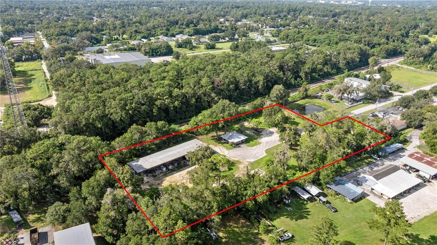 Prime M1-Zoned Industrial Property in the City of Ocala
Discover an exceptional opportunity with this fully fenced 2.72-acre industrial property, ideally located on a quiet dead-end road within Ocala city limits. Zoned M1, this property is well-suited for light manufacturing, warehousing, distribution, or a variety of industrial uses.
Property Highlights:
* Land: 2.72 acres, fully fenced and secured, offering ample yard space for equipment, storage, or expansion
* Office Building: 36’ x 36’ (approx. 1,296 sq ft) featuring:
    * 2 restrooms
    * Employee kitchen/breakroom
    * Private office
    * Reception area
    * New plumbing (2023)
    * New metal roof (2018)
* Industrial Amenities:
    * Large covered concrete manufacturing pad
    * 3,000-gallon double-walled diesel fuel tank
    * Two 250-gallon above-ground off-road fuel tanks
This property combines functionality, security, and convenience, making it an ideal base of operations for your business. Its location within city limits ensures easy access to major transportation routes and utilities while providing privacy and limited traffic due to the dead-end road.
Contact us today to schedule a private showing and explore the possibilities this property offers!
