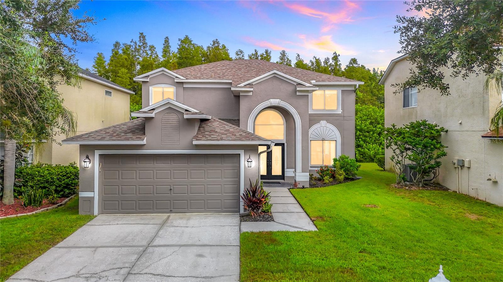One or more photo(s) has been virtually staged. Discover your dream home at 4219 Harbor Lake Dr, nestled in the serene Heritage Harbor Golf community in Lutz, FL. This stunning two-story single-family home boasts over 3,000 square feet of heated living space, backing up to a tranquil wooded conservation area for ultimate privacy and natural beauty. Featuring 4 spacious bedrooms, 3 full bathrooms, and a versatile office/media room, this residence is perfect for families and entertainers alike. The first floor showcases elegant bamboo flooring, arched doorways, and crown molding, with separate living and dining rooms flowing into a bright family room with sliders opening to picturesque conservation views. The gourmet kitchen and updated bathrooms are adorned with granite countertops and stainless steel appliances, while the primary bathroom offers luxury with dual sinks, a garden tub, and a separate shower. Recent upgrades include a new roof and two new AC units installed in 2020, along with fresh exterior paint. Step outside to enjoy the expansive covered and screened patio, complete with a custom firepit area, ideal for relaxing or hosting gatherings.
Living in Heritage Harbor Golf community means access to exceptional amenities, including a public golf course, driving range, Recreation Center, on-site restaurant, resort-style pool with a water park, parks, playgrounds, and tennis courts. Zoned for the highly sought-after A-rated school campus of George Steinbrenner High School, McKitrick Elementary, and Martinez Middle, this location is perfect for families. The home is conveniently located just minutes from the Suncoast Expressway via Lutz Lake Fern, with daycares, pre-schools, shopping, and restaurants all within a 15-minute drive.
Explore nearby attractions within 20 miles, such as the vibrant Tampa Riverwalk (18 miles), offering dining, shopping, and scenic waterfront views, or the thrilling rides and wildlife exhibits at Busch Gardens Tampa Bay (16 miles). For outdoor enthusiasts, Lake Park (7 miles) provides trails, fishing, and kayaking, while Clearwater Beach (20 miles) beckons with its white sands and stunning sunsets. Enjoy cultural experiences at the Tampa Museum of Art (18 miles) or family-friendly fun at ZooTampa at Lowry Park (14 miles). With its prime location, modern upgrades, and access to top-tier community amenities, 4219 Harbor Lake Dr is more than a home—it's a lifestyle.