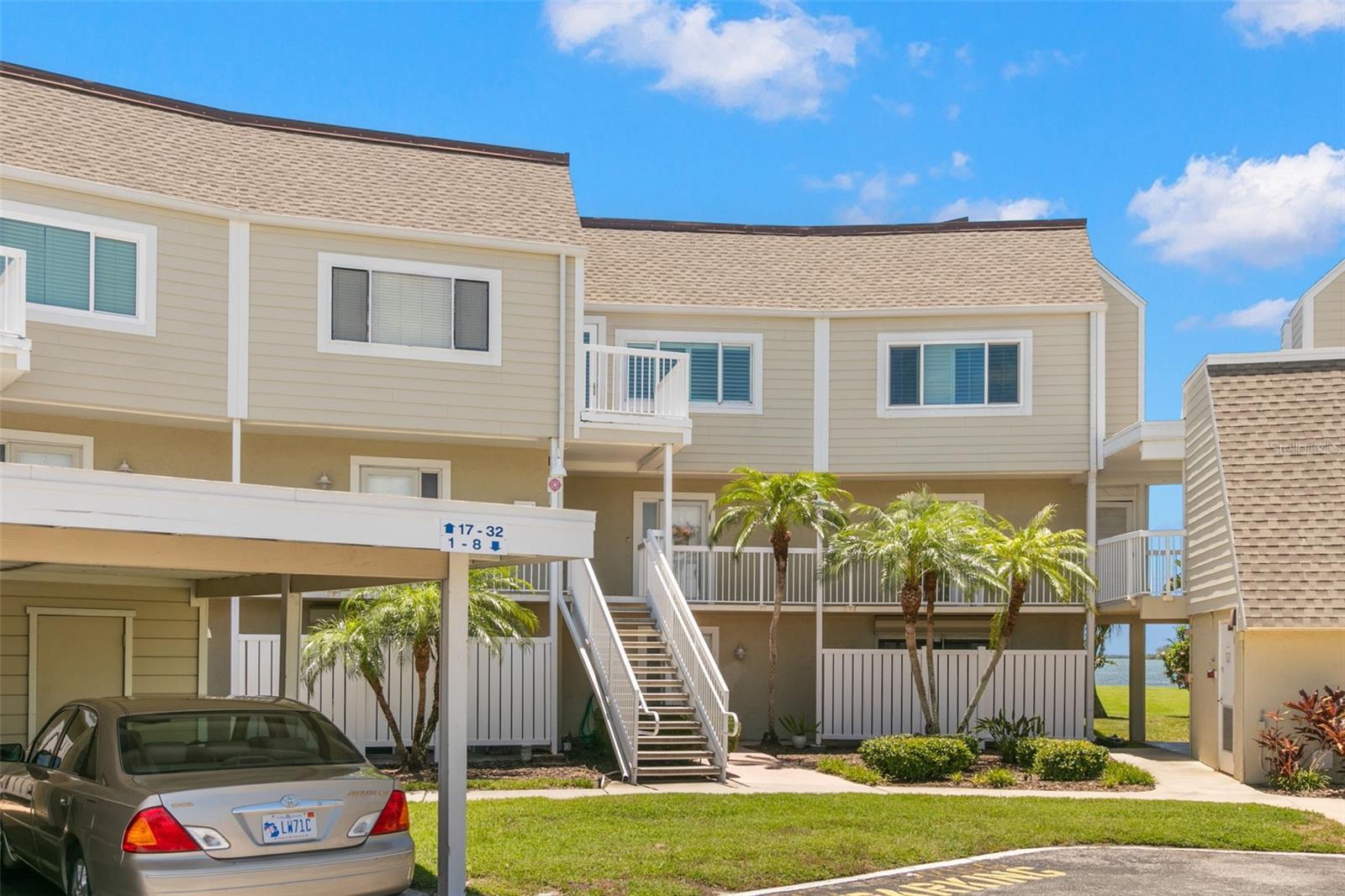 “WOW”. This is a beautiful updated condominium that boasts a spacious and modern design with 3 bedrooms and 2 ½ baths with breathtaking views of the Gulf of Mexico including Caladesi Island on Dunedin Beach. The gourmet kitchen has a lot of seating for entertaining and just hanging out with all the innovative storage you need underneath the island. Little hideaway’s such as the microwave, coffee corner, and a creative beautiful pull-out shelving and storage under the staircase. The living room with crown molding offers a beautiful custom made fireplace with views of the beautiful sunsets. The comfortable open concept between the living room, kitchen and dining area is light and bright. The handy laundry room with a pocket door offers you storage and a large stackable washer and dryer. The updated powder room is convenient for your guests. The dining room is light and bright with a calming sitting area that looks out to the large patio where you get to see the million dollar view. The awning that covers you from some of the sun and rain. The unit provides you with hurricane shutters. Both guest bedrooms face the water and one has a small patio. A very convenient updated 2nd floor guest bathroom offers you a bathtub/shower with a beautiful waterfall backsplash, rain head in the shower, tile floor and tile counter tops with a lots of storage. The primary bedroom and ensuite has recently been updated and has a small patio from bedroom. The primary bathroom has great lighting, shiplap walls, rain head in shower, 3 medicine cabinets, his and hers sinks, stylish fixtures, tile counters and lots of storage with tile flooring. Between the bedroom and ensuite there are two dual closets, one walk in and one built in. Plenty of uncovered parking for your guest or 2nd car. Each unit has an assigned covered parking spot with storage. The pool area has a privacy fence, shuffleboard court, heated pool, lots of seating with covered areas, grill, clubhouse, outside shower, two inside showers and bathrooms in the clubhouse. The clubhouse offers a kitchen area, dining table, foosball and a pool table. The community offers a first come first time base kayak rack and storage units for an additional fee. The area is in prime location with easy access to multiple marinas. The community is in walking distance to the Pinellas bike trail, Honeymoon Island, restaurants, gym, Walgreens, banks, 2 hotels and across the street from Frenchy’s Outpost Restaurant. This condo is a slice of a secret paradise.