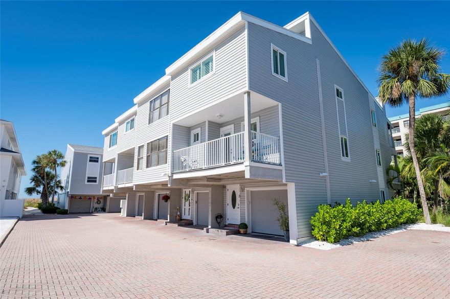 Welcome to CEDARSANDS, a rare BEACHSIDE GEM on TREASURE ISLAND. This 2-bedroom 3 full bath + 2 BONUS ROOMS  is a rare find.  An intimate eight-unit community is tucked away among luxurious waterfront estates and located directly on the GULF, providing access to white sandy beaches and mesmerizing SUNSET VIEWS. The ground floor features a one-car garage and a spacious BONUS ROOM (14 x 16), perfect as a third bedroom, home office, gym, or extra storage. Sliding glass doors open to a covered, brick-paved patio with an outdoor shower, surrounded by a private vinyl fence and gate door that leads directly to the beach. Ascending to the second floor, you'll find a bright and open living room with a wood-burning fireplace, a dining area that comfortably seats 9, and a full bath.  The entire level features ceramic tile flooring, complementing the spacious kitchen with STAINLESS STEEL APPLIANCES, GRANITE COUNTERTOPS, TONS OF CABINETS, and a NEW REFRIGERATOR. Off the living room, step onto a covered balcony, perfect for outdoor dining, complete with a spiral staircase leading down to the ground-floor patio. From the kitchen balcony, enjoy your morning coffee or evening cocktails. The third floor offers two inviting bedrooms with VINYL. FLOORING THROUGHOUT. The primary suite includes his-and-hers closets, a PRIVATE BALCONY, a bathroom with a soaking tub with jets. The guest bedroom features its own ensuite bath for ultimate privacy. A BONUS LOFT ( 16 x 15 ) crowns the top level, complete with a CUSTUM BUILT-IN STORAGE SYSTEM, ideal as an additional bedroom, office, or creative retreat. Enjoy the best of coastal living just 1/2 mile away from JOHNS PASS VILLAGE, 20 min away from the airport, and offering exceptional restaurants, shopping, boating, and entertainment - all while nestled in a quiet, upscale enclave on 
TREASURE ISLAND'S  pristine shores.