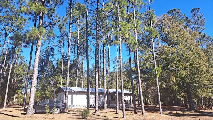 30 Minutes from either Lake City or Gainesville minutes from the Santa Fe River and nearby Springs.  Nicely maintained 2br. 1 Bath Trailer on 5 acres, in southern Columbia County.  Central Air and Heat, Metal Roof