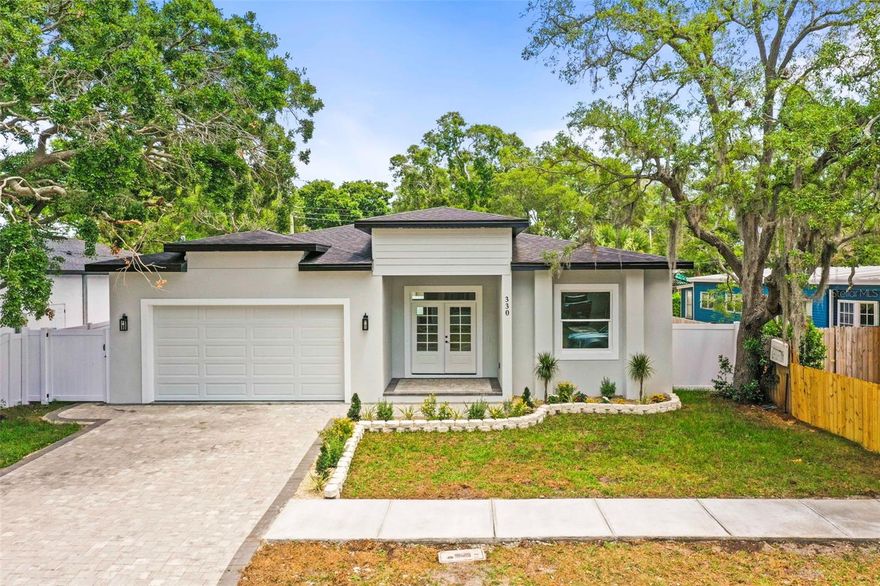 Welcome to this stunning new construction home perfectly located in one of Dunedin’s most desirable areas, offering the ideal blend of luxury, convenience, and the ultimate Florida lifestyle. From the moment you arrive, you’ll be impressed by the beautiful curb appeal featuring a paver patio, lush tropical landscaping, an inviting covered front porch, and striking double front doors that open into a grand foyer entrance.

Step inside to an impressive open-concept floor plan filled with natural light, soaring ceilings, and upscale modern finishes throughout. The spacious living room showcases a custom built-in shelving feature wall, creating the perfect centerpiece for entertaining or relaxing. The gourmet kitchen is truly a showstopper with quartz countertops, custom cabinetry, upgraded stainless appliances, designer finishes, and an oversized island ideal for hosting family and friends.

The stunning primary suite offers a luxurious private retreat with plenty of space to unwind. The spa-inspired primary bathroom features beautiful double vanities, designer finishes, and a gorgeous oversized walk-in shower that creates a true resort-style feel. The primary suite also includes a spacious walk-in closet with custom closet systems designed for both style and functionality, offering exceptional storage and organization. Additional custom closets throughout the home provide plenty of storage space while maintaining the clean modern aesthetic of the property.

Built for both style and peace of mind, this home features solid block construction along with hurricane impact windows and doors throughout. The oversized two-car garage includes an epoxy-finished floor, while the expansive backyard offers endless possibilities with plenty of room to create your dream outdoor oasis. There is ample space for a custom pool, outdoor kitchen, and a large screened-in lanai, giving you the opportunity to design the ultimate Florida backyard retreat perfect for entertaining, relaxing, and enjoying year-round outdoor living.

What truly sets this property apart is the incredible location. Hop on your golf cart or bike and be in Downtown Dunedin within minutes where you can enjoy award-winning restaurants, breweries, rooftop bars, boutique shopping, waterfront parks, festivals, live music, and the famous Pinellas Trail. You are also only about five minutes from Countryside Mall for convenient shopping and dining, and approximately 7–10 minutes from Honeymoon Island State Park where you can enjoy some of Florida’s most beautiful beaches, kayaking, boating, fishing, and breathtaking sunsets.

Located outside the City of Dunedin limits, this property offers added flexibility with potential short-term rental opportunities, making it an incredible option for a primary residence, vacation home, or income-producing investment property.

This is more than just a home — it’s a chance to live the highly sought-after Dunedin lifestyle in a beautifully built modern new construction home. Schedule your private showing today.
