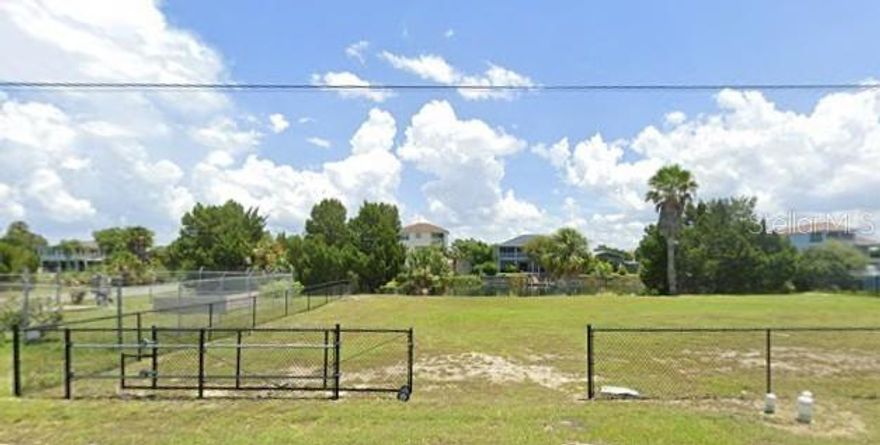 What a great find! This OVERSIZED lot is ready to build your perfect home overlooking the calm waters of the canal.  This 116' wide lot gives you plenty of water frontage for all of your water toys.  The lot is currently fenced in on the 3 non water sides with a rolling gate large enough for a vehicle to pass through and can easily be repositioned after your new home is built.