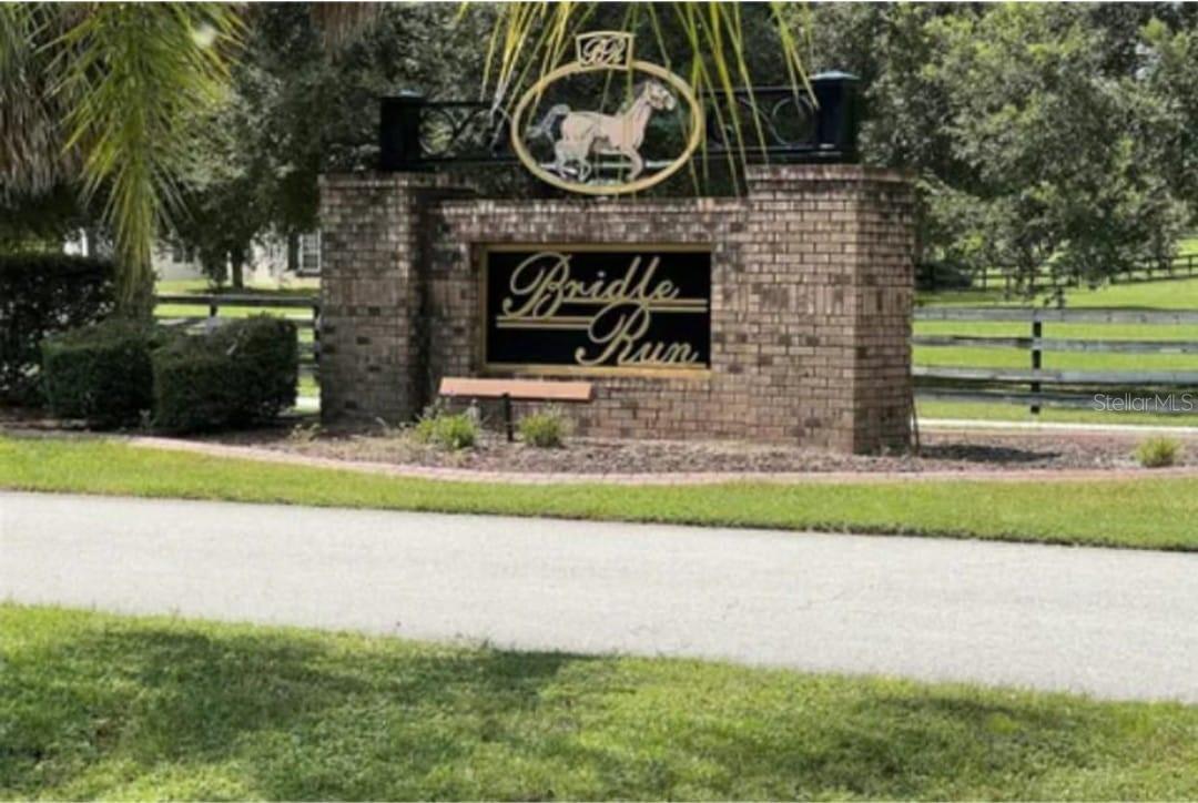 Located in South Ocala, this exceptional 5-acre property offers a rare opportunity to live in Bridle Run and create your own dream estate. This parcel is the last vacant lot. With a prime location and a tranquil pond, this slice of paradise is perfect for those seeking a serene and spacious retreat. You'll have plenty of room for outdoor activities, gardening, or simply enjoying the Florida sunshine. With 5 acres of prime Florida real estate at your disposal, your imagination is the only limit. Whether you envision a sprawling ranch-style residence, a cozy cabin, or a modern architectural masterpiece, this blank canvas is ready for your unique vision. If you're an equestrian enthusiast, you'll be delighted to know this property is horse-friendly. There's ample room to create your own horse retreat with plenty of room for stables and pastures. The Bridle Run community offers a bridle path around the perimeter of the property. Ocala is famous for its equestrian culture and natural beauty. This property is ideally located in downtown Ocala, top-rated schools, shopping, dining, and entertainment options. Plus, you'll have convenient access to some of Florida's most pristine parks and nature trails. Whether traveling to nearby cities or needing quick access to major highways, this property's central location provides easy connections to major routes, making commuting a breeze. Don't miss this incredible opportunity to own a piece of Ocala's prime real estate. With horses allowed, a beautiful pond, and endless possibilities, this 5-acre property is your chance to create the lifestyle you've always dreamed of. Contact us today to schedule a showing and start turning your dreams into reality in Ocala, Florida.