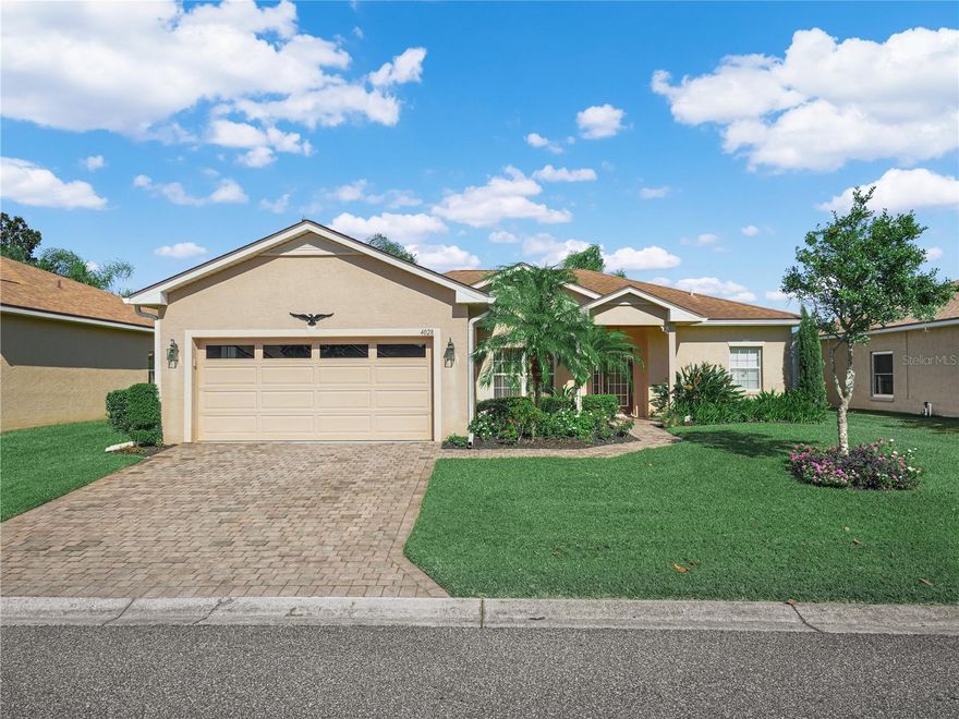 4028 Birkdale Drive Lake Wales, Florida is a 3 Bedroom / 2 Bath, Devon Floor Plan with over 1,700 sq.ft.. Located on a quiet street in Lake Ashton, this split plan floor plan offers a sunroom/lanai with glass door sliders all around.  The kitchen has custom tile counters and a custom sitting bench in the dinette area. The living room and formal dining room flow nicely together and the lanai is conveniently located off the living room. The sunroom/lanai has privacy shades and ceiling fans and the floor is tile. The primary bedroom offers a large walk in closet, a closet with bi-fold doors,  a shower tub combo and a separate water closet with walk in shower.  The guest bath has a walk in shower and is accessible from both the hall and Bedroom 3. The washer/dryer will convey with the sale of this home. You'll enjoy hot water on demand in this home, too. The Seller is offering a Flooring Credit to the Buyer at the time of Closing.       Lake Ashton is an affordable and desirable 55+. It's simply the best. Lake Ashton's amenities include a 26,000 sq.ft. clubhouse with bowling lanes, theater, billiards, fitness center, outdoor heated pool, grand ballroom, restaurant and more. There is also a 30,000 sq. ft. health and fitness center with indoor pool, indoor 1/2 court basketball, indoor racquetball, tennis courts, pickle ball courts, large flex room and more. Lake Ashton features two 18-hole golf courses, boat ramp and dock and storage facilities. Schedule your appointment today!