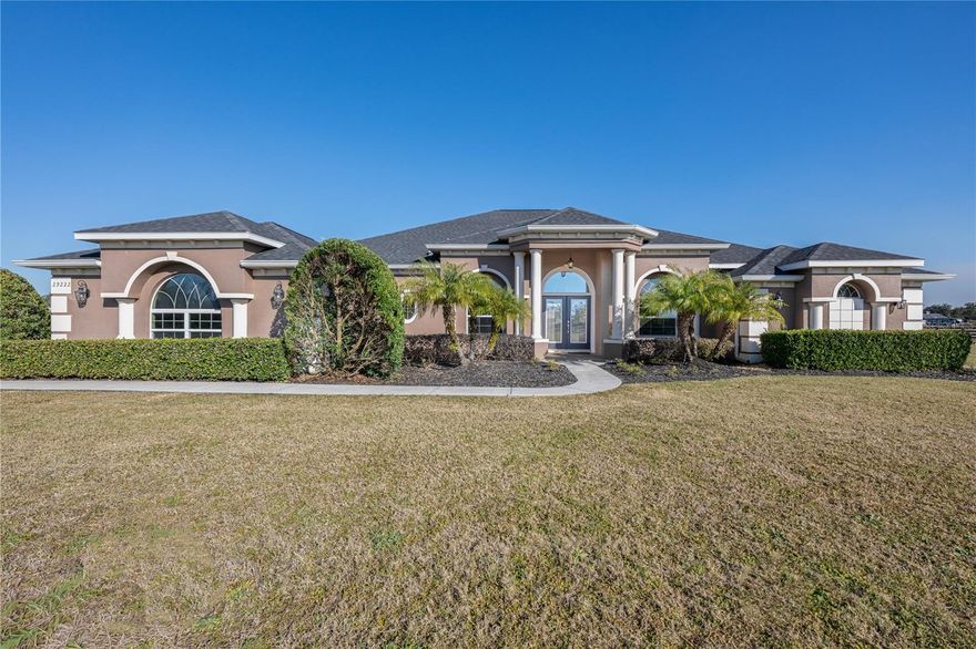 Experience Luxury Country living on this stunning 5-acre estate in Tavares, Florida. Built in 2019, this custom 4-bedroom, 3-bath pool home offers the perfect blend of elegance, privacy and functionality - fully fenced and ready for horses or your favorite outdoor hobbies. Step inside to an inviting open layout featuring soaring 10-ft ceilings, abundant natural light, and premium finishes throughout. The gourmet kitchen is the heart of the home, showcasing expansive countertops, high-end cabinetry, and generous space for cooking and entertaining. Relax in the spacious primary suite, unwind by the sparkling pool, or enjoy the wide-open acreage ideal for equestrian lovers, gardening, or simply enjoying the ultimate privacy. Enjoy the Florida lifestyle with a sparkling pool, expansive outdoor space, and room to create the property of your dreams. The HOA allows two additional buildings, giving you the freedom to add a barn, workshop, RV garage, or storage for all your toys. Located just minutes from downtown Mount Dora and the Harris Chain of Lakes, this property offers quick access to charming shops, dining, and world-class boating and fishing—while still providing the privacy and tranquility of acreage living.
A rare opportunity to own a modern luxury home with land, flexibility, and an unbeatable location.