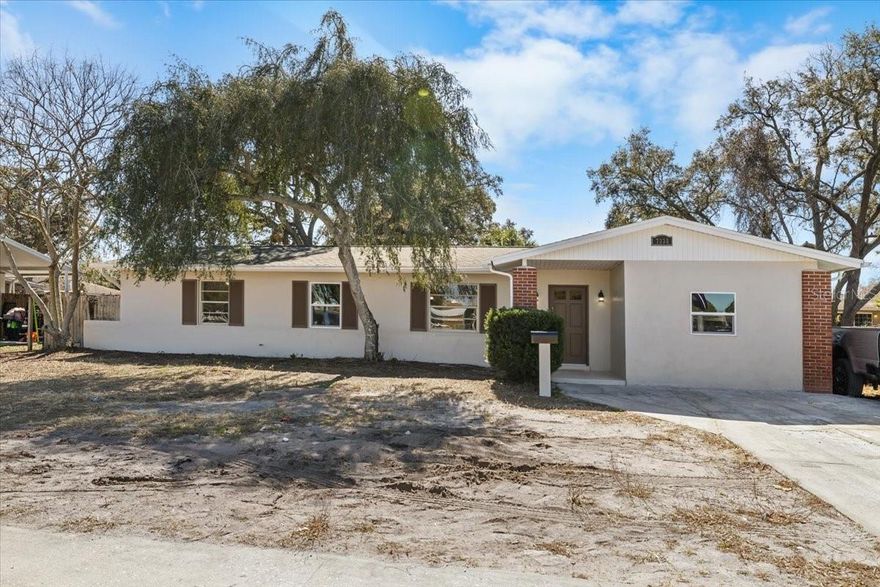 COMPLETELY RENOVATED 4BR/2BA HOME IN A PRIME CENTRAL LOCATION – MOVE-IN READY!
Welcome to this beautifully updated 4-bedroom, 2-bathroom home in a CENTRALLY LOCATED AREA with UNMATCHED CONVENIENCE. Just steps from a PHARMACY, GROCERY STORE, GYM, BANK, AND POST OFFICE, with PUBLIC TRANSPORTATION NEARBY, this home offers EFFORTLESS ACCESS TO SHOPPING, DINING, AND COMMUTING.
Inside, enjoy BRAND-NEW LAMINATE WOOD FLOORING throughout the main living areas and NEW CARPET IN ALL BEDROOMS. The SPACIOUS, FUNCTIONAL FLOOR PLAN features a FORMAL LIVING ROOM, SEPARATE FAMILY ROOM, and a DEDICATED DINING AREA off the FULLY RENOVATED KITCHEN, perfect for ENTERTAINING AND EVERYDAY LIVING.
The BRAND-NEW KITCHEN showcases MODERN  CABINETRY, STAINLESS STEEL APPLIANCES, a DEEP SINGLE-BASIN SINK, and GENEROUS COUNTER SPACE for cooking and hosting.
The PRIVATE PRIMARY SUITE includes a WALK-IN CLOSET and a BEAUTIFULLY REMODELED EN-SUITE BATH with DUAL VANITIES and a FLOOR-TO-CEILING TILED WALK-IN SHOWER. Three additional bedrooms are located on the opposite side of the home and share a FULLY UPDATED GUEST BATHROOM with a TILED TUB/SHOWER COMBO.
Step outside to a SCREENED-IN LANAI and FULLY FENCED BACKYARD, ideal for RELAXING, ENTERTAINING, PETS, OR PLAY. FULLY RENOVATED AND MOVE-IN READY, this home offers a SPLIT-BEDROOM FLOOR PLAN, MODERN FINISHES THROUGHOUT, and a PRIME LOCATION WITH WALKABLE ACCESS TO SHOPS AND EVERYDAY CONVENIENCES, plus EASY ACCESS TO DINING, MAJOR ROADS, AND PUBLIC TRANSPORTATION.
Additional upgrades include a NEW AC in 2024, NEW HOT WATER HEATER in 2024, and a NEW ROOF in 2020.
Perfect for HOMEOWNERS OR INVESTORS seeking a TURNKEY PROPERTY in a CENTRAL, ACCESSIBLE LOCATION. SCHEDULE YOUR PRIVATE SHOWING TODAY—THIS ONE WON’T LAST!