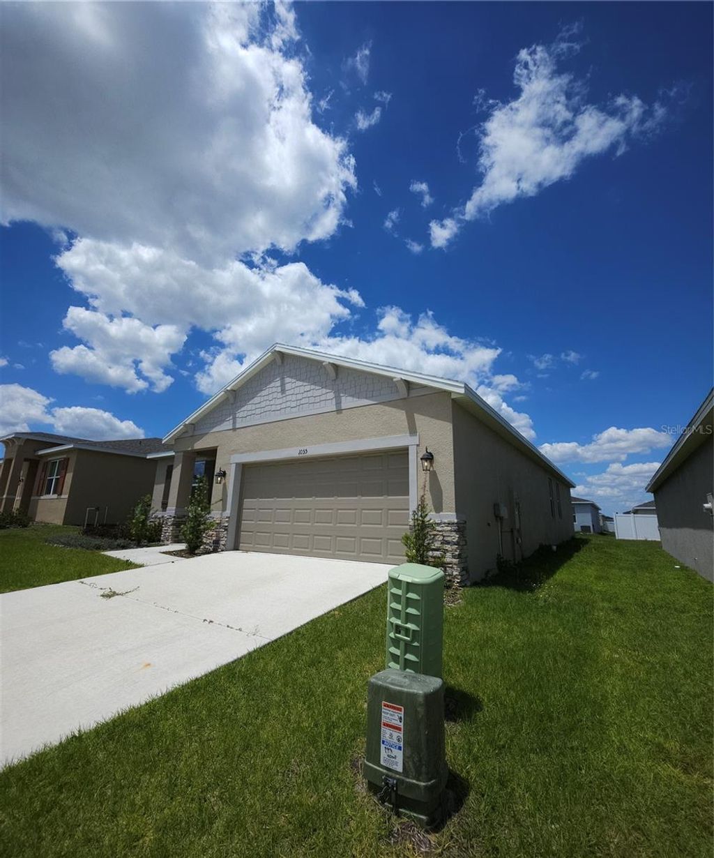 Photo of 1055 Patriot Loop, Haines City, FL 33844 (MLS # S5141959)