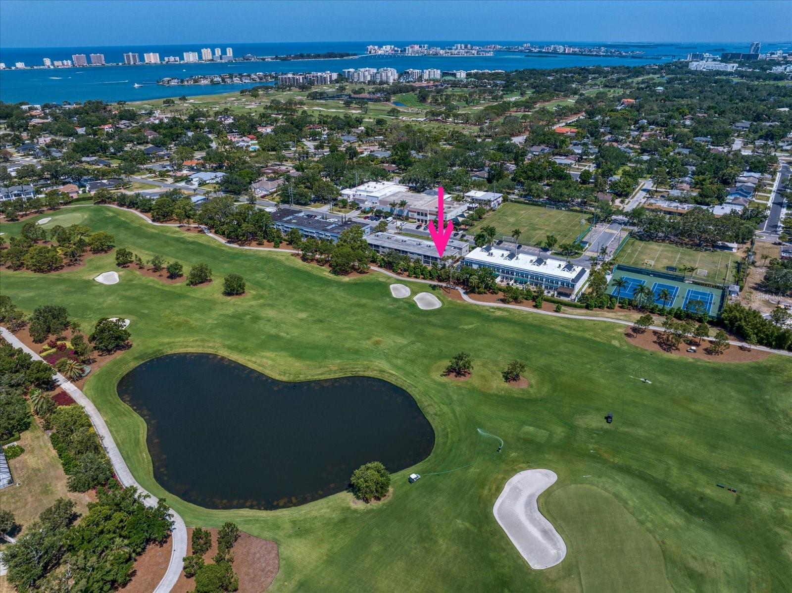 Experience quiet, carefree living in this immaculately maintained end-unit condo, offering extra square footage and picturesque views of the prestigious Pelican Golf Club. Bathed in natural light, the open and bright floor plan features a kitchen with quartz countertops and ample workspace, seamlessly flowing into the dining and living areas, perfect for entertaining. From the living room, sliders open to a screened patio, perfect for enjoying serene golf course vistas. The spacious primary bedroom also boasts access to the patio, accompanied by a beautifully renovated ensuite with a walk-in shower. An additional bedroom with two closets shares a hall bath featuring a tub/shower combo. Practical amenities include abundant storage, a separate kitchen entrance, wind/hurricane rated windows including the slider in the primary, and a retractable screen on the front door, allowing for delightful cross ventilation and gentle breezes throughout the condo. Residents have the option to join the nearby Dimmitt Community Center, offering access to tennis, pickleball, men’s basketball, Pilates, and various social activities. Ideally located, this condo is in close proximity to shopping, dining, two airports, and the area’s famous white sand beaches.